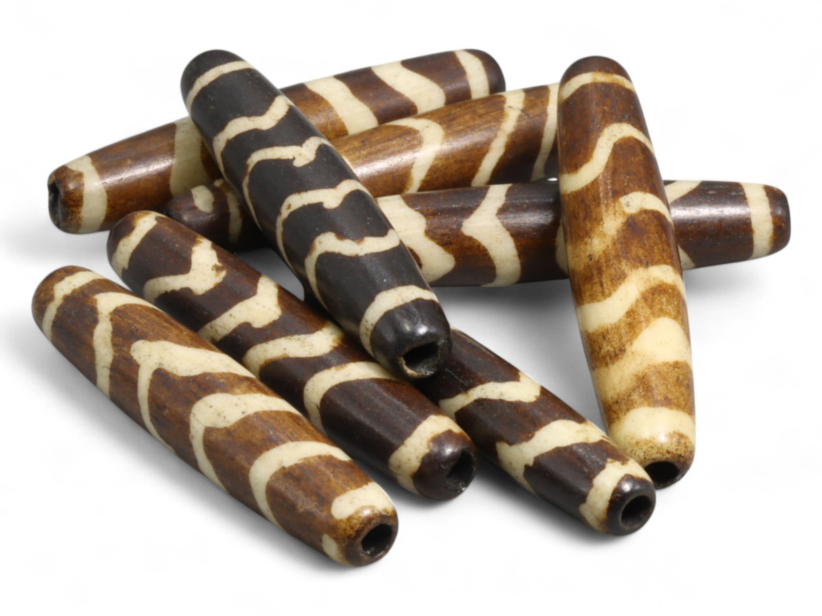 Vintage Tibetan Tiger Stripe Yak Bone Bead, Wave Motif Amulet, c. Mid-20th Century, 18g: This vintage Tibetan yak bone bead features the classic "tiger stripe" or wave motif, a design long admired across Himalayan cultures for its energetic and protective symbolism. Crafted in the mid-20t