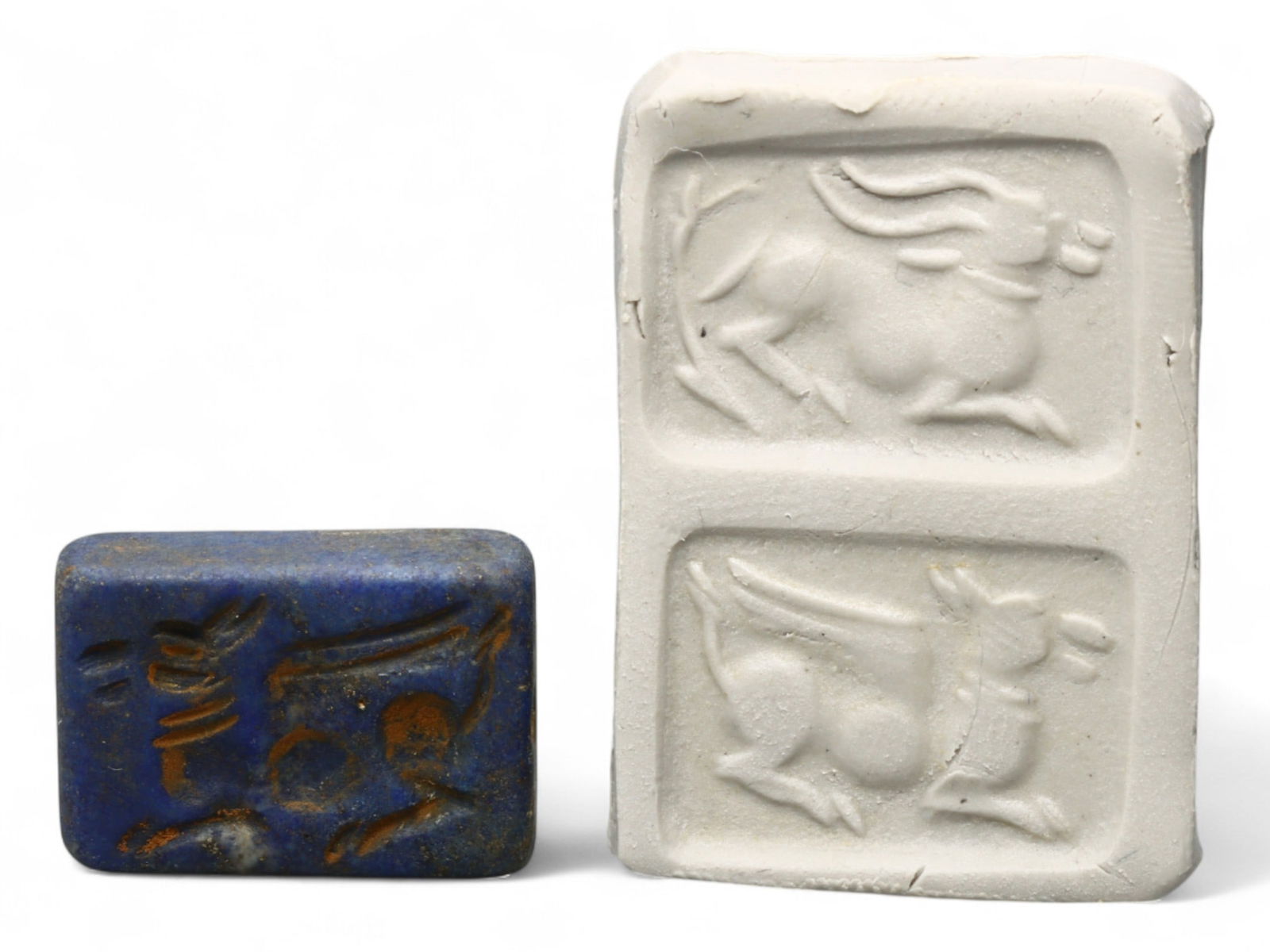 Ancient Elamite Lapis Lazuli Stamp Seal of Reclining Bull, c. 2500-1800 BCE, 3.8g: This finely carved lapis lazuli stamp seal, dating to the Elamite-Indus interaction period (c. 2500-1800 BCE), presents a powerful depiction of a reclining bull in dynamic motion. Measuring 2 x 1 cm a