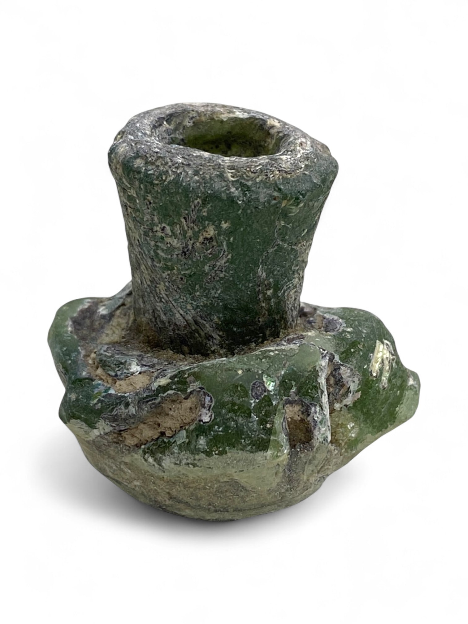 Ancient Roman Forest-Green Mold-Blown Glass Unguentarium, c. Severan Era, 3rd Century CE, 39g: Dating to the transformative era of the Severan dynasty in the early 3rd century CE, this robust forest-green Roman glass unguentarium is a striking remnant of daily luxury in antiquity. The Severans