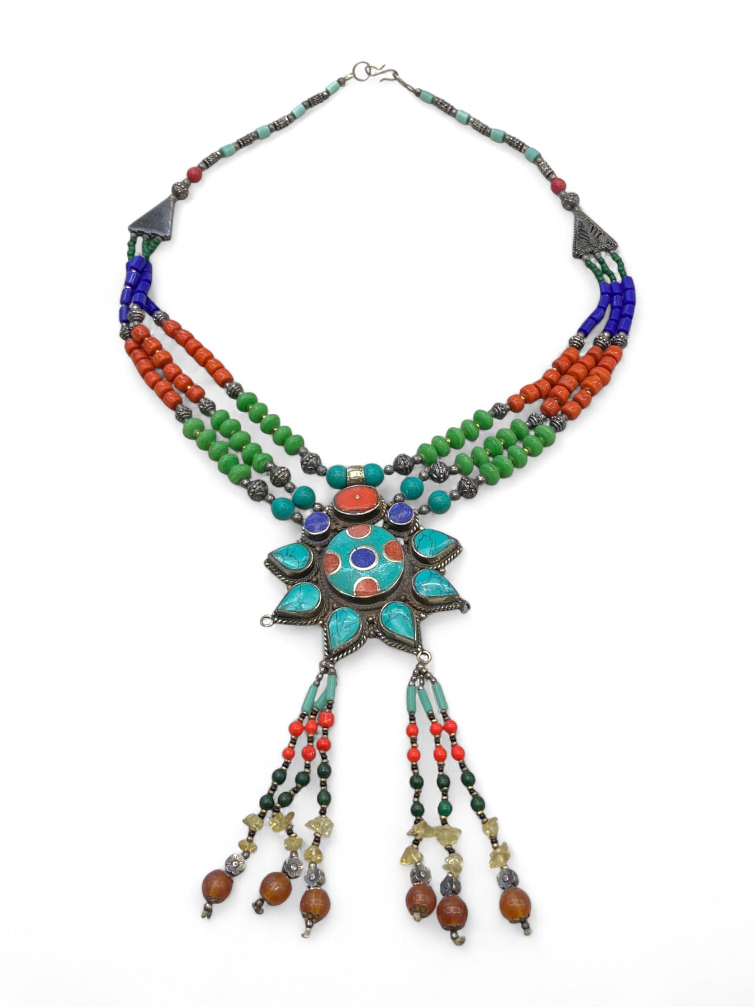 Afghan Tribal Sunburst Pendant Necklace with Coral, Turquoise and Glass Beads, 155g: This radiant Afghan tribal necklace features a bold sunburst pendant-a powerful symbol of life, energy, and protection-rendered in vibrant inlays of turquoise, red coral, and blue glass. Framed in a d