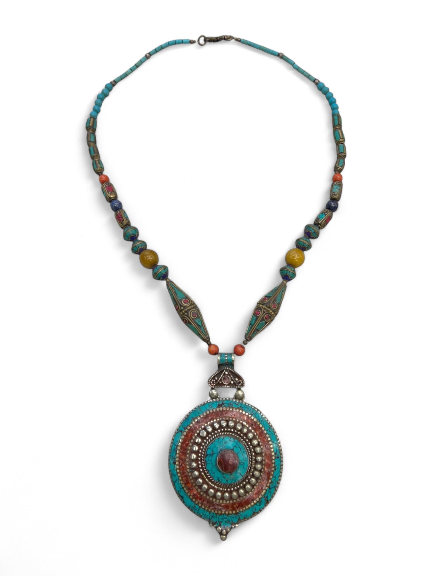 Central Asian Turquoise and Coral Inlay Necklace with Silver Pendant and Beaded Strand, 110g: This elegant Central Asian necklace is a masterful blend of vivid color and traditional craftsmanship, centered by a commanding round pendant inlaid with turquoise, coral, and silverwork. The medallio