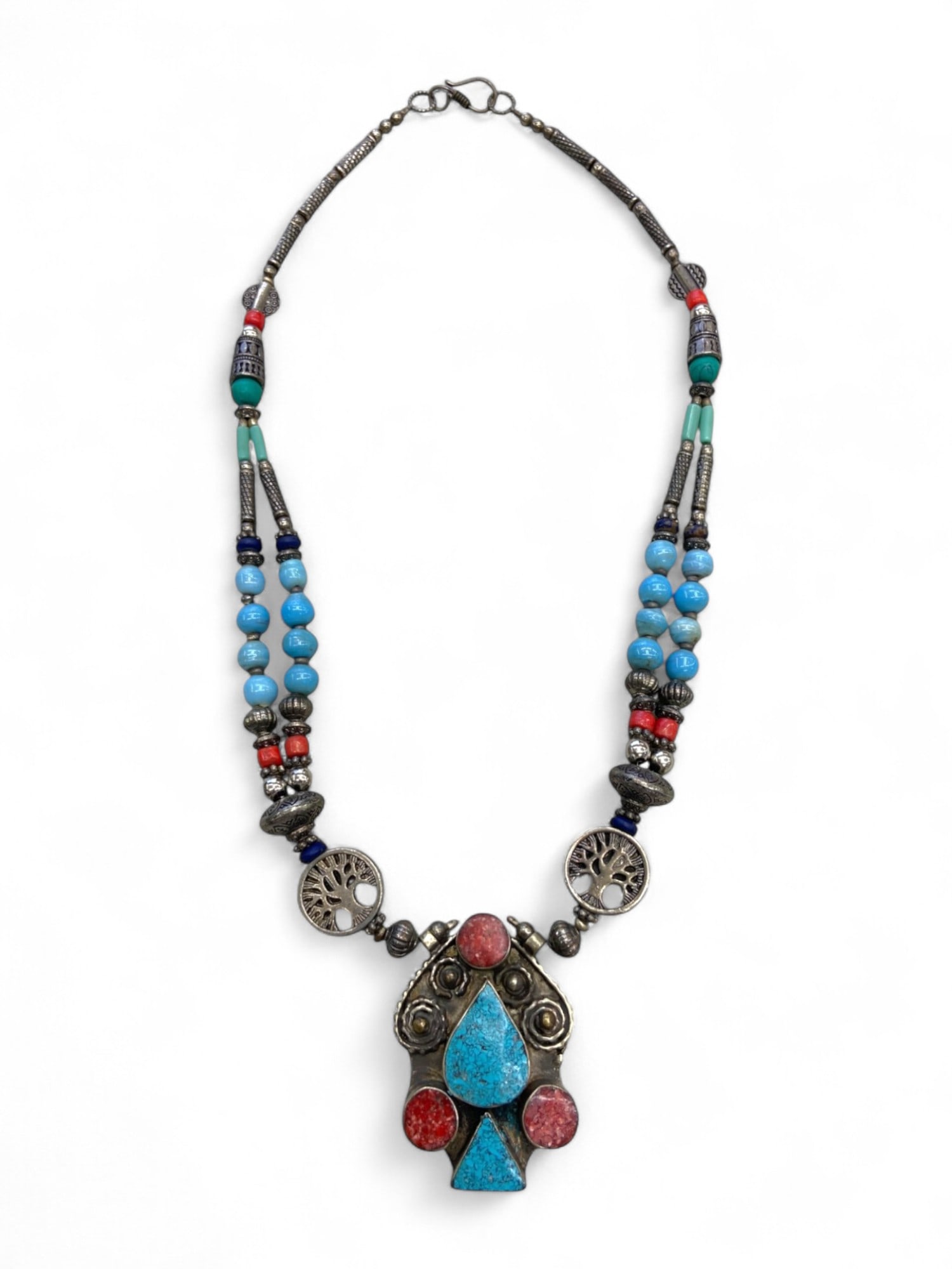 Central Asian Turquoise and Red Resin Beaded Necklace with Symbolic Tree Medallions, 90g: This stunning Central Asian necklace is a bold fusion of tribal symbolism and regional artistry, anchored by a dramatic pendant set with textured turquoise inlays and vibrant red resin cabochons. The 