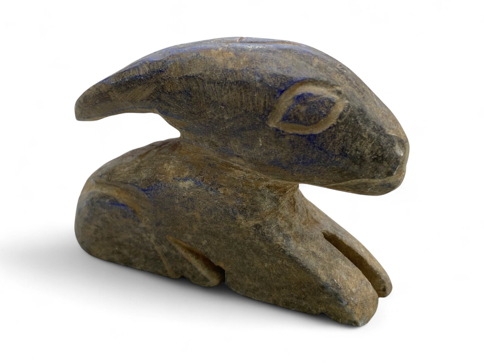 Ancient Bactrian Lapis Lazuli Effigy of Seated Goat or Ibex, c. 3rd-2nd Millennium BCE, 78g: This graceful effigy of a goat or ibex, carved from veined lapis lazuli, hails from ancient Bactria in Central Asia and dates to the 3rd-2nd millennium BCE. Measuring 6 cm in length and weighing 78 gr