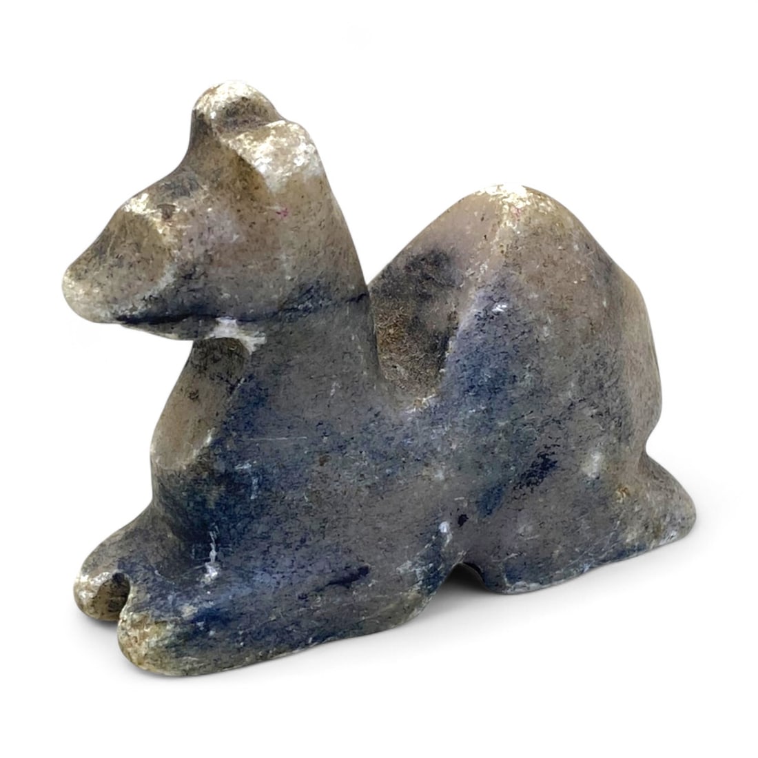 Ancient Near Eastern Zoomorphic Stone Camel Effigy, c. 1st Millennium BCE, 78g: This remarkable zoomorphic effigy, carved from mottled grey stone, depicts a resting camel-a symbolic and practical animal central to the trade and survival of ancient Near Eastern civilizations. Like