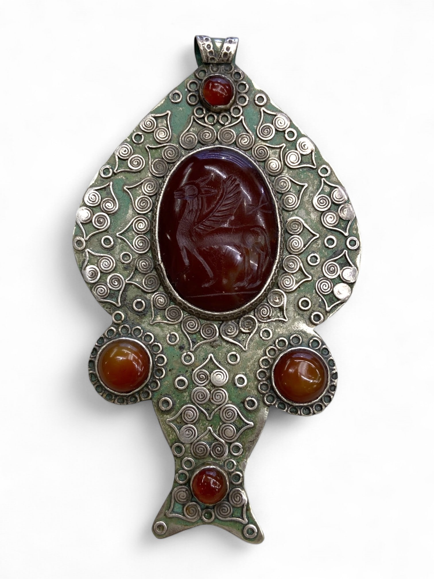 Antique Persianate Griffin Intaglio Silver Alloy Pendant, c. 19th-Early 20th Century CE, 83g: This magnificent Persianate pendant radiates power and protection through its dynamic depiction of a griffin - the legendary guardian beast - carved in bold relief at the heart of an 83-gram silver al