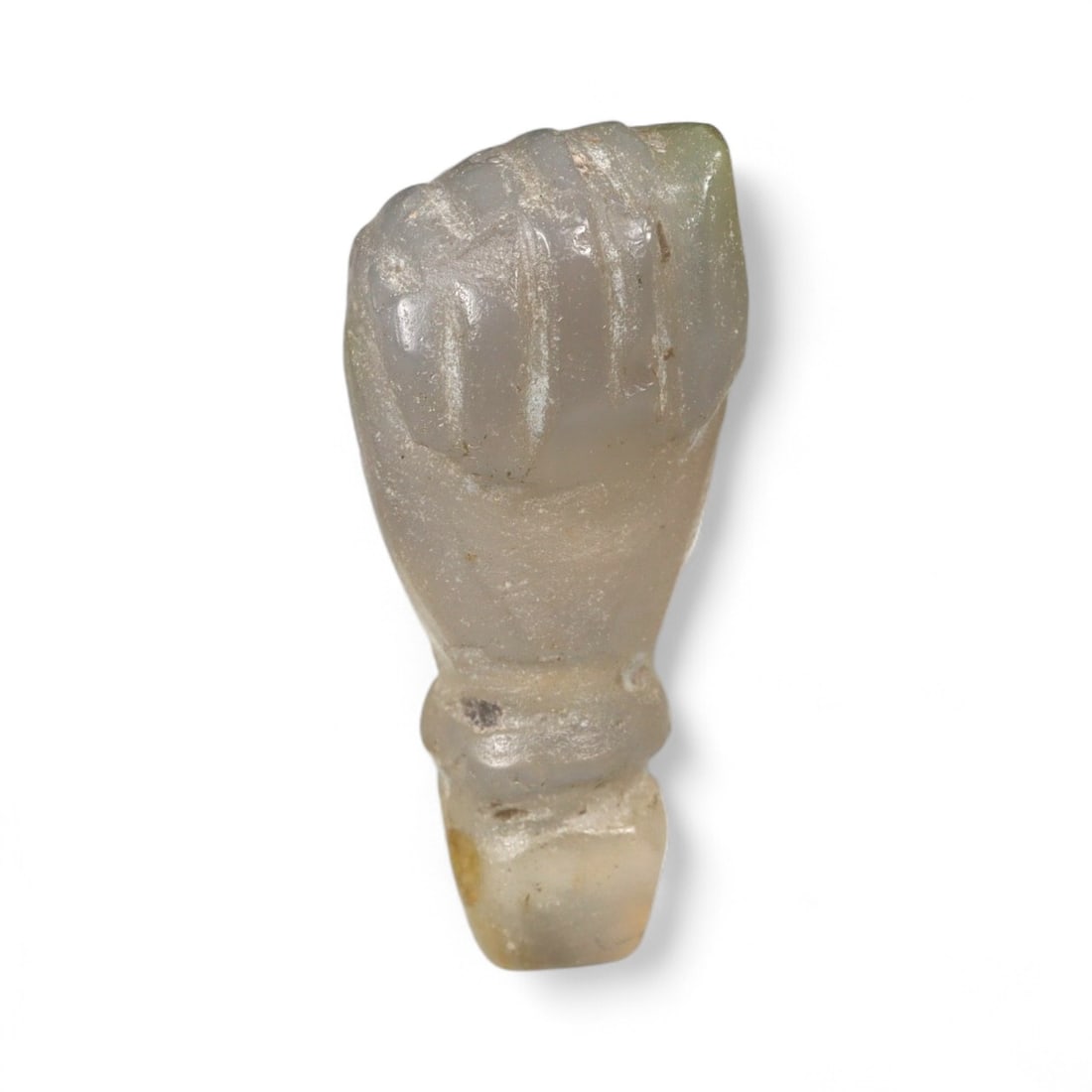 Ancient Coptic Egyptian Chalcedony Fist Amulet, c. 5th-7th Century CE, 3g: This translucent chalcedony amulet, masterfully carved into the shape of a clenched right fist, dates to the Coptic period of late antiquity in Egypt, c. 5th-7th century CE. Measuring 2.4 cm and weigh