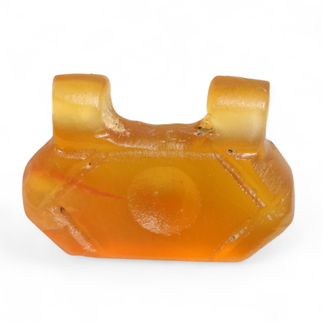 Ancient Coptic Egyptian Geometric Twin-Loop Carnelian Amulet, c. 6th-8th Century CE, 1g: This angular and elegantly minimalist amulet, carved during the 6th-8th century CE in Coptic Egypt, displays a bold geometric form defined by symmetry, balance, and subtle symbolism. Featuring a twin-