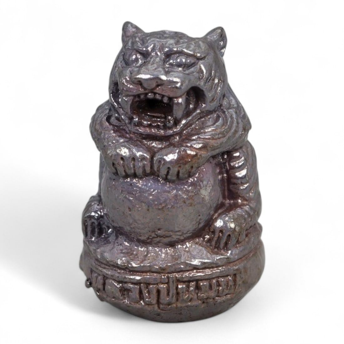 Antique Thai Tiger Guardian Amulet in Bronze Alloy, Early 20th Century, 24g: This powerful bronze alloy tiger amulet, small in size yet rich in symbolism, is a striking representation of Thai protective magic from the early 20th century. The tiger, or Suea, is revered in Thai 