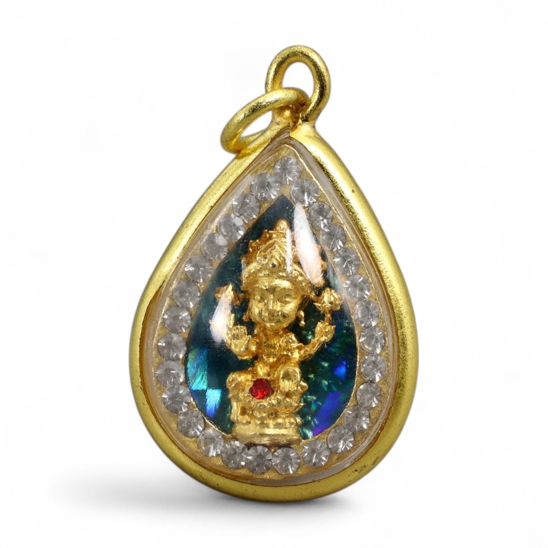 Vintage Thai Lakshmi Prosperity Deity Amulet in Rhinestone Gilt Case, c. 20th Century, 5g: This vivid vintage Thai amulet presents a miniature image of Lakshmi-the Hindu goddess of wealth and auspicious fortune-enshrined in a teardrop-shaped gilt case accented with clear rhinestones. Lakshm