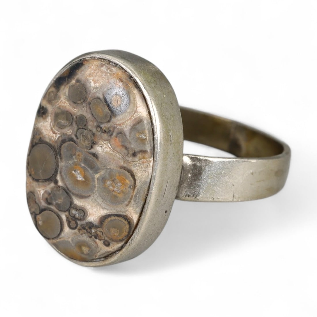 Bohemian Polished Leopard Skin Jasper Oval Silver Ring, c. Mid-20th Century, US Size 9.5, 4g: This unique mid-20th-century silver ring features a striking oval-cut leopard skin jasper-a stone prized for its wild, orb-like patterns and earthy tones. Popular in Bohemian and folk-inspired jewelry