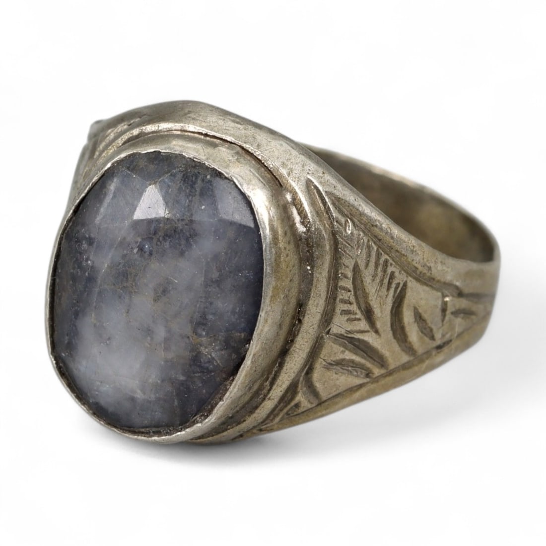 Indo-Islamic Star Sapphire Silver Heirloom Ring, c. Late 19th Century, 4g: This evocative silver ring likely hails from the Indo-Islamic cultural sphere of the late 19th century, where gemstone mysticism and intricate metalwork formed the core of personal adornment. Centered