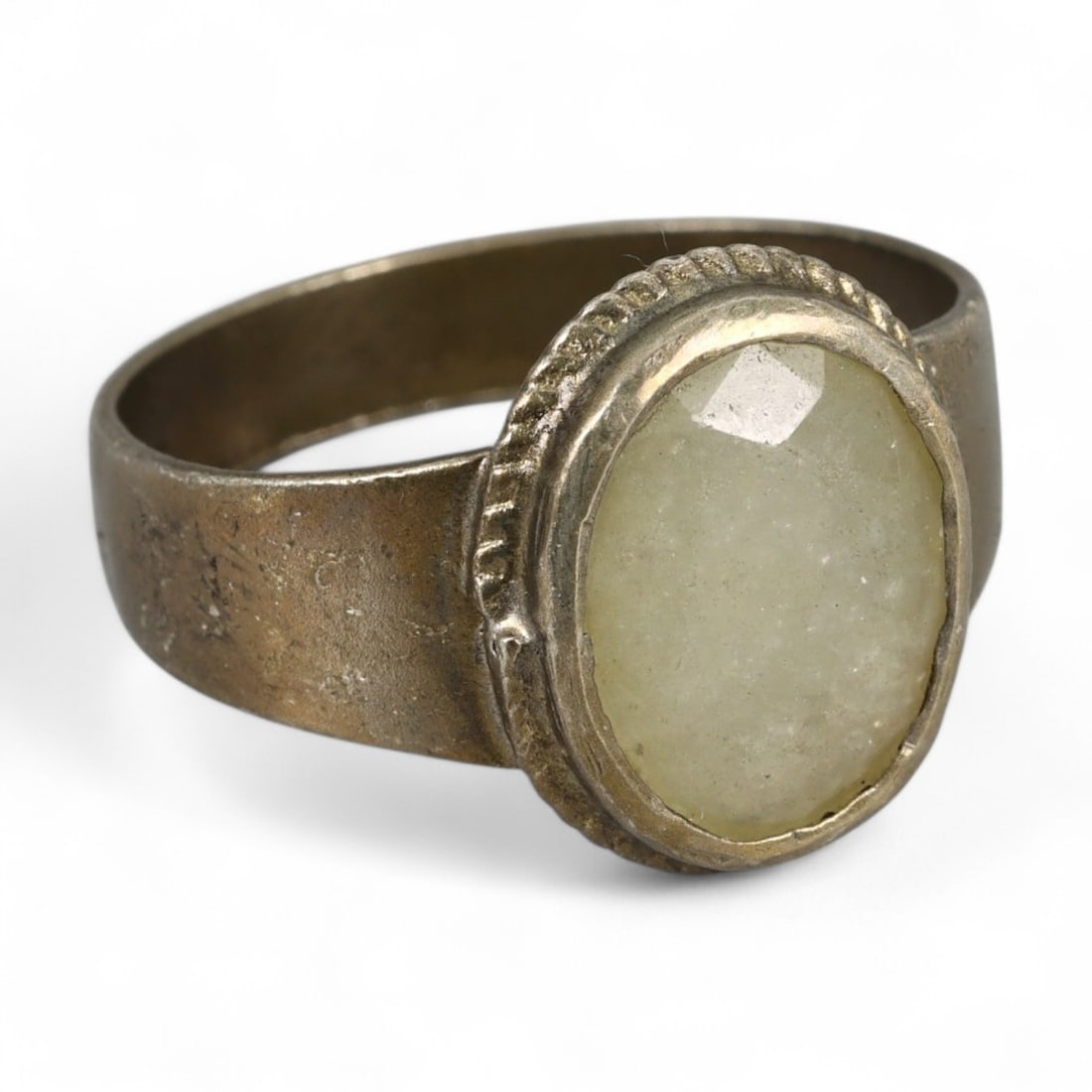 Antique Middle Eastern Faceted Quartz Devotional Silver Ring, c. Early 20th Century, 4g: This understated antique silver ring, likely originating from the Middle East or Central Asia in the early 20th century, carries with it a quiet spiritual presence. Set with a pale, faceted quartz cab