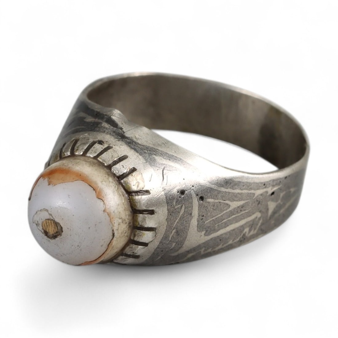 Ottoman-Inspired Talismanic White Agate Silver Ring, c. Early 20th Century, 3g: Delicate yet charged with symbolism, this early 20th-century silver ring bears the unmistakable imprint of Ottoman folk design. At its center is a rounded white agate cabochon-pierced at the core and 