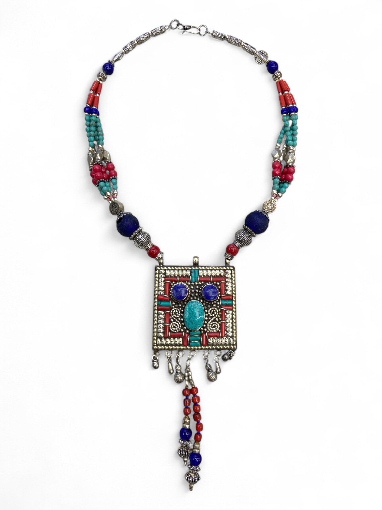 Vintage Himalayan Tribal Turquoise Coral Lapis Silver Necklace, 20th Century, 146g: This striking 20th century Himalayan necklace exemplifies the bold artistry of tribal jewelry from the mountain regions of Nepal and Tibet. Crafted with a commanding square pendant framed in intricate