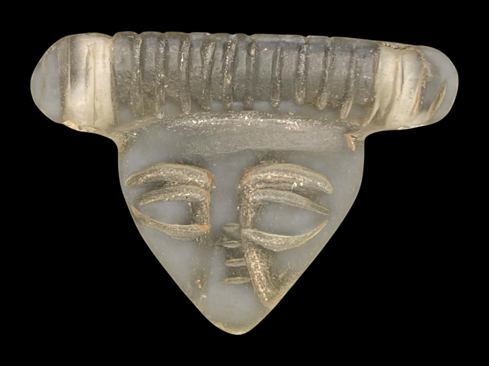Ancient Sasanian Rock Crystal Anthropomorphic Head Amulet, c. 3rd–6th Century CE, 10g: This unusual rock crystal amulet, dating to the Sasanian Empire (c. 3rd–6th century CE), is carved in an anthropomorphic form, blending human facial features with exaggerated stylization. Measuring 