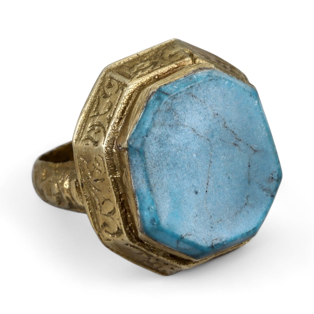 Antique Persian Style Octagonal Turquoise Silver Gilt Ring, c. 19th-20th Century 8g: This antique silver gilt ring, dating to the 19th-20th century, highlights the refined aesthetics of Persian jewelry, where geometry and symbolism were closely interwoven. The bezel is set with a larg