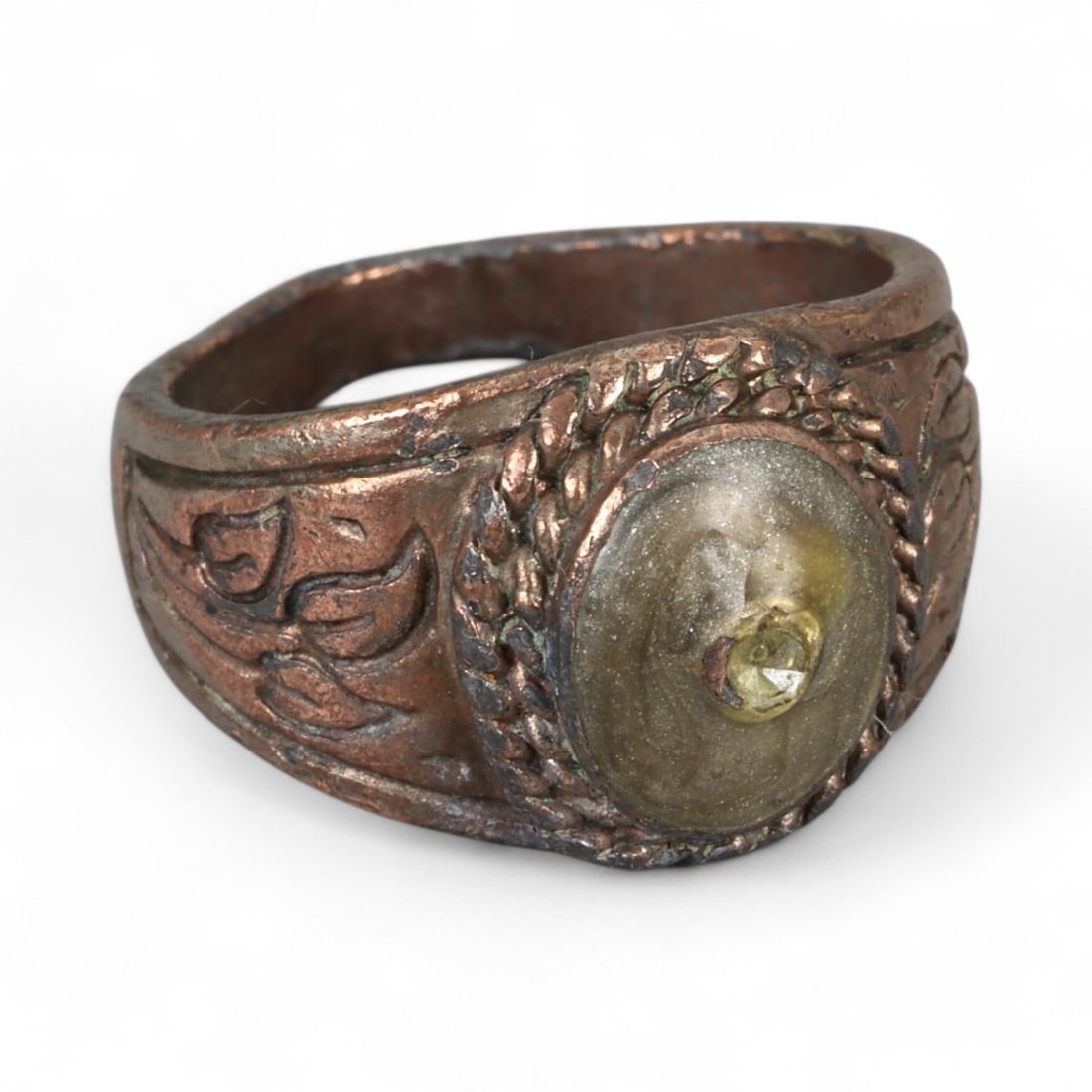 Antique Persian Style Yellow Glass Inlay Copper Alloy Ring, c. 19th-20th Century 10g: This antique copper alloy ring, dating to the 19th-20th century, reflects the practical yet symbolic jewelry traditions of Persian and Central Asian craftsmanship. The bezel features a rounded yellow 