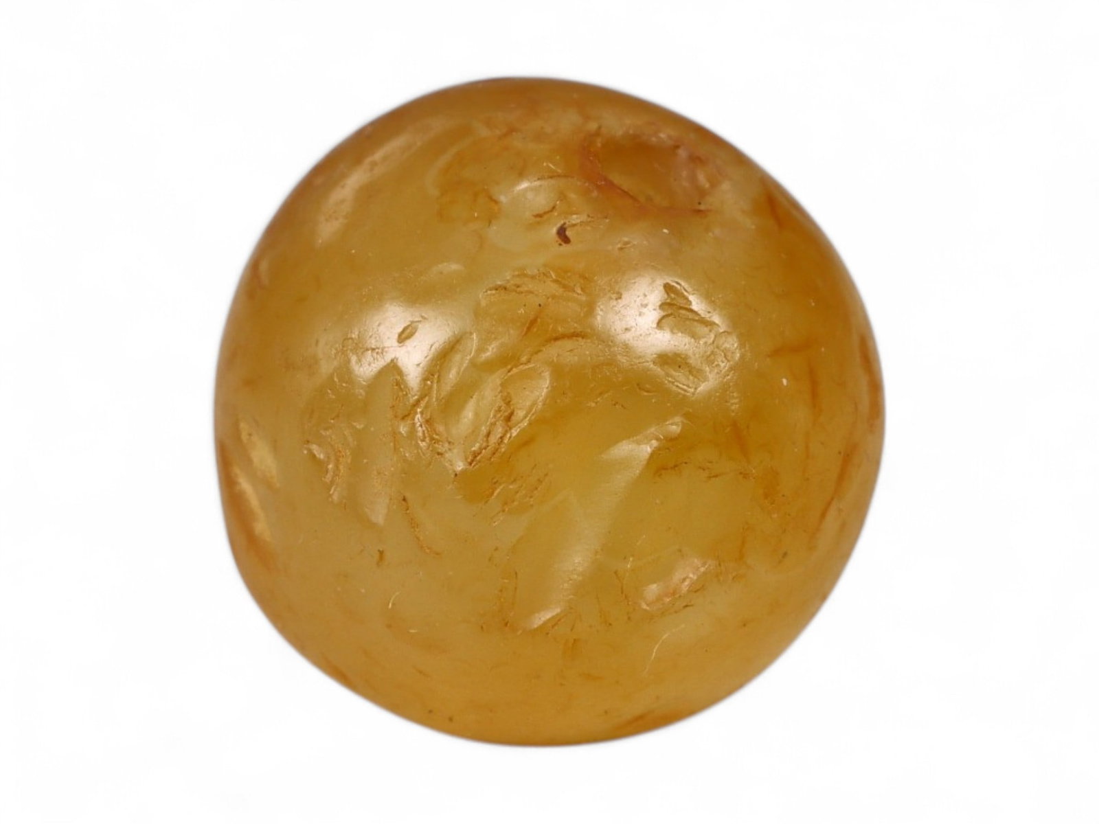 Ancient Roman Honey Agate Spherical Bead, c. 1st-3rd Century CE 3.5g: This warm honey-toned spherical bead, carved from agate, measures 1.3 cm and weighs 3.5 grams. Its rich translucence and smooth polish are characteristic of Roman lapidary craftsmanship during the Imp