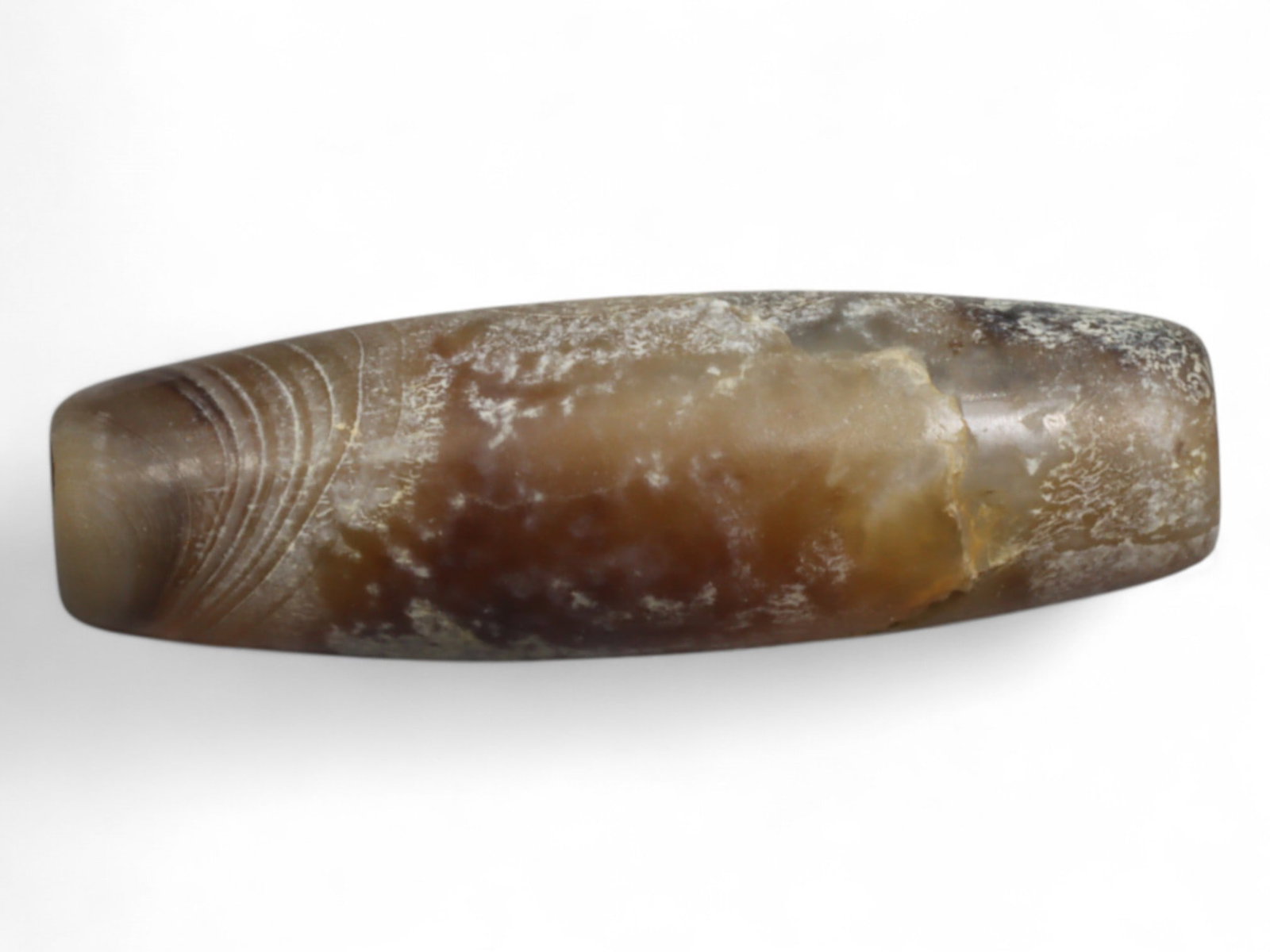 Ancient Persian Banded Agate Bead, Parthian-Roman Period c. 1st-3rd Century CE, 1.9cm, 1g: This elegant banded agate bead, originates from Persia during the Parthian-Roman cultural horizon of the 1st-3rd century CE. Agate, with its natural striations and layered beauty, was one of the most 