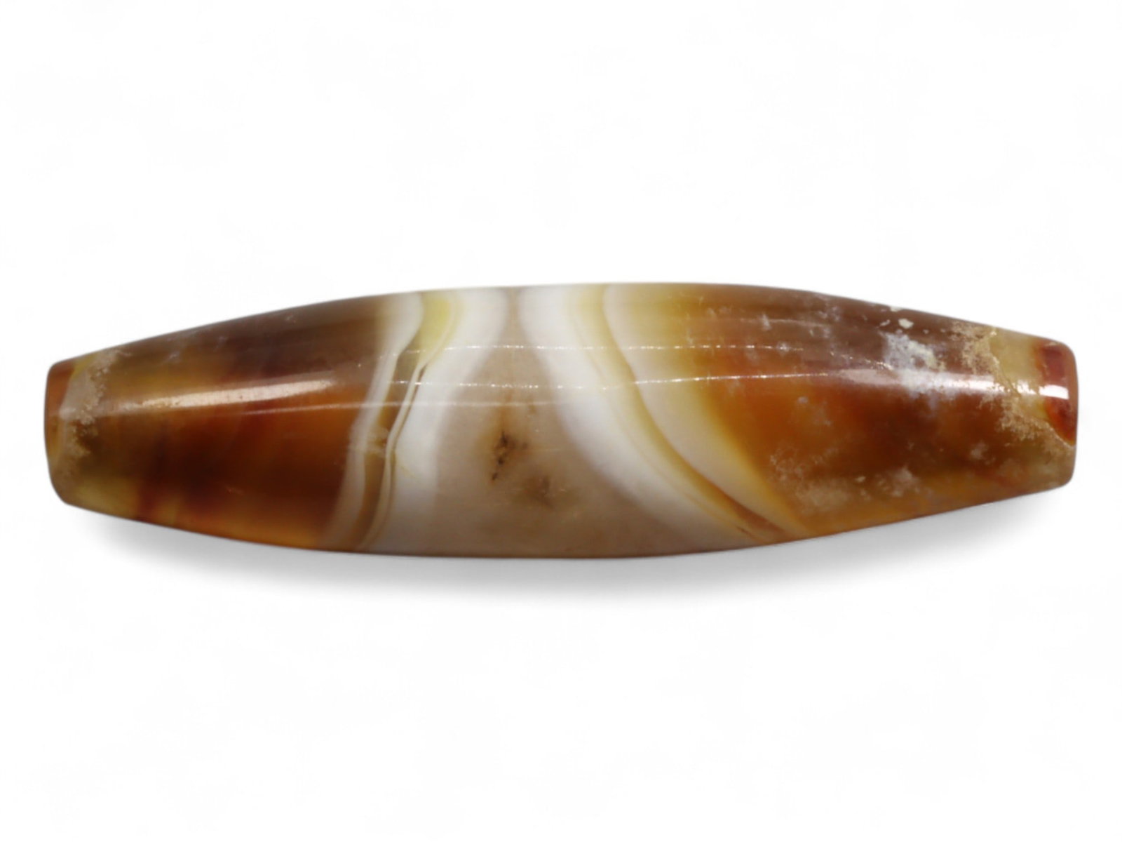 Ancient Achaemenid-Parthian Banded Agate Bicone Bead, c. 5th Century BCE-2nd Century CE, 3.6cm, 5g: This striking banded agate bead, measuring 4.2 cm and weighing 10 grams, is fashioned in the long bicone shape, one of the most enduring and elegant bead forms of the ancient Near East. The stone's na