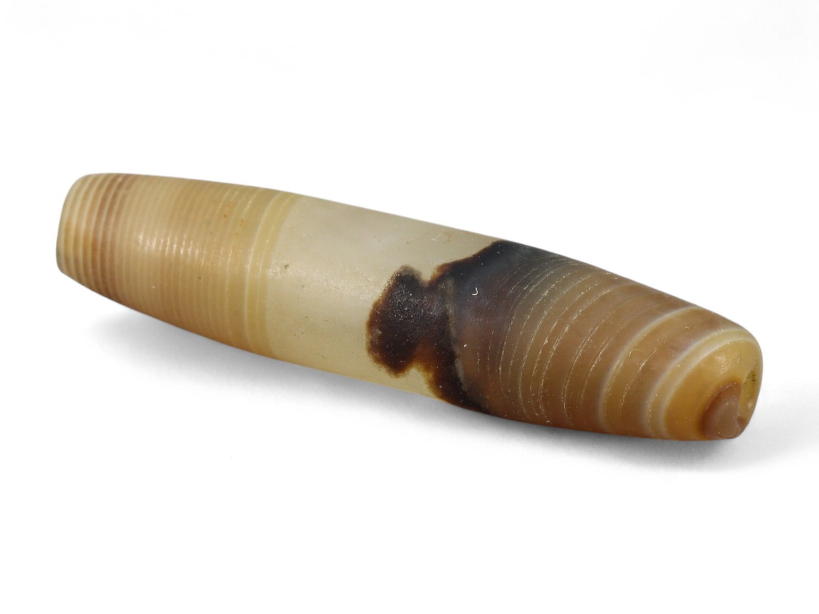 Ancient Persian Banded Agate Bead, Parthian-Roman Period c. 1st-3rd Century CE, 2.5cm, 1.3g: This elegant banded agate bead, originates from Persia during the Parthian-Roman cultural horizon of the 1st-3rd century CE. Agate, with its natural striations and layered beauty, was one of the most 