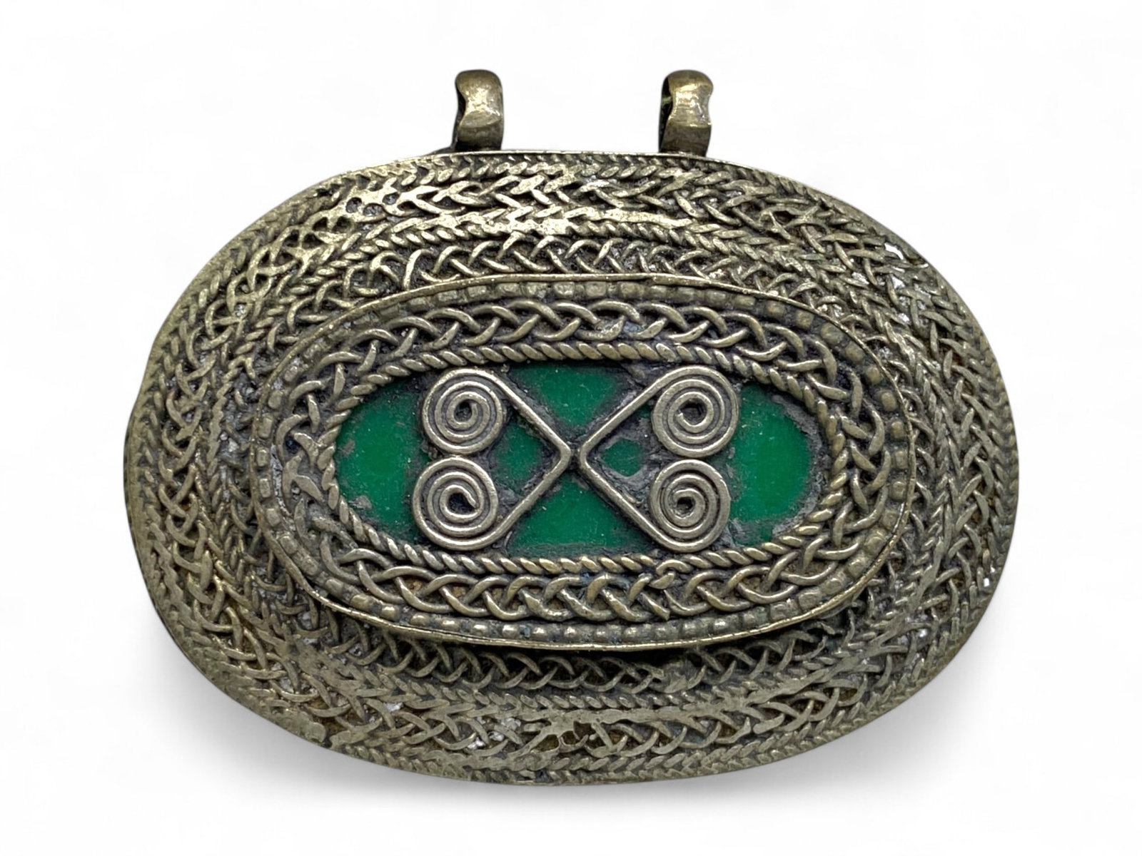 Antique Himalayan Tribal Green Stone Spiral Motif Silver Amulet Pendant, 20th Century, 32g: This antique Himalayan pendant highlights the powerful symbolism of spiral motifs, long associated with cycles, continuity, and spiritual energy. At its center lies a polished green stone panel, overl