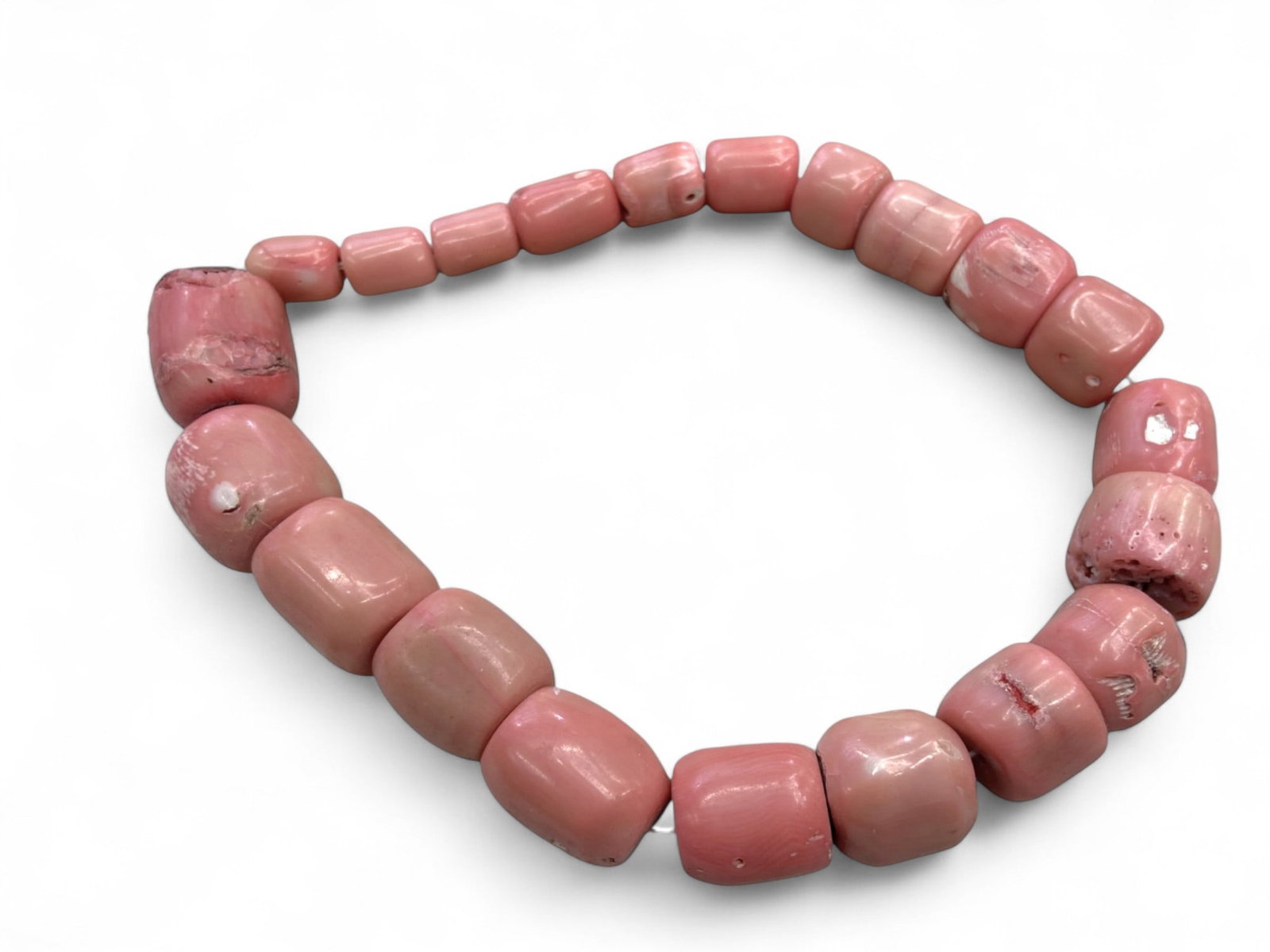 Vintage Mediterranean Pink Coral Bead Strand, c. Mid-20th Century, 153g: This vintage strand of natural pink coral beads embodies the elegance and rarity of one of the most coveted organic gemstones of the Mediterranean. Shaped into barrel and rounded forms, the beads reve