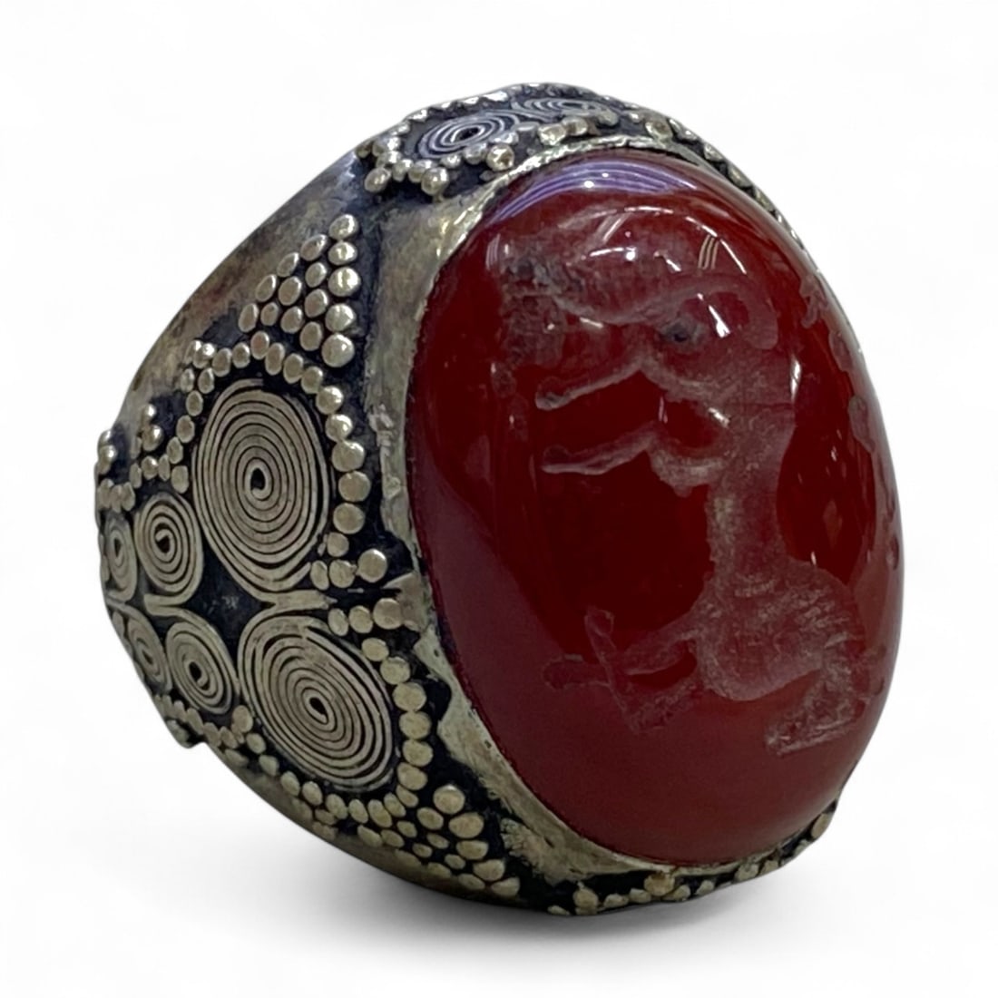Antique Central Asian Silver Ring with Carved Carnelian Intaglio, c. 19th Century, US Size 8, 18g: This bold antique silver ring, dating to the 19th century Central Asian tradition, features a striking red carnelian intaglio carved with the image of a rearing animal, possibly a lion or horse. The s