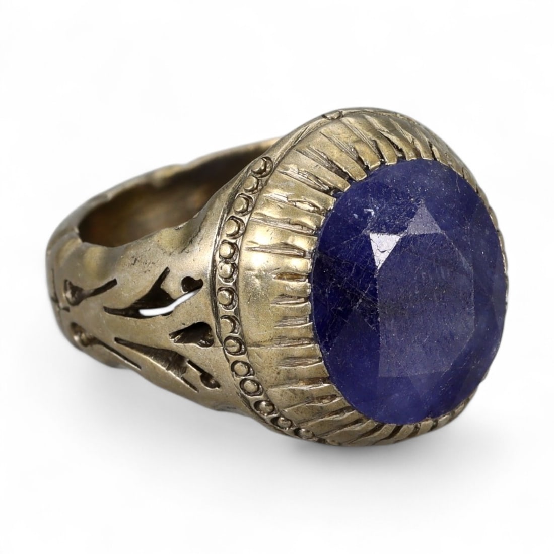 Antique Persian Qajar Sapphire Blue Cabochon Silver Ring, c. 19th Century 15.4g: This bold antique silver ring originates from the Qajar Dynasty of 19th century Persia, a period renowned for its fusion of traditional Persian artistry with influences from Ottoman and Mughal courts.