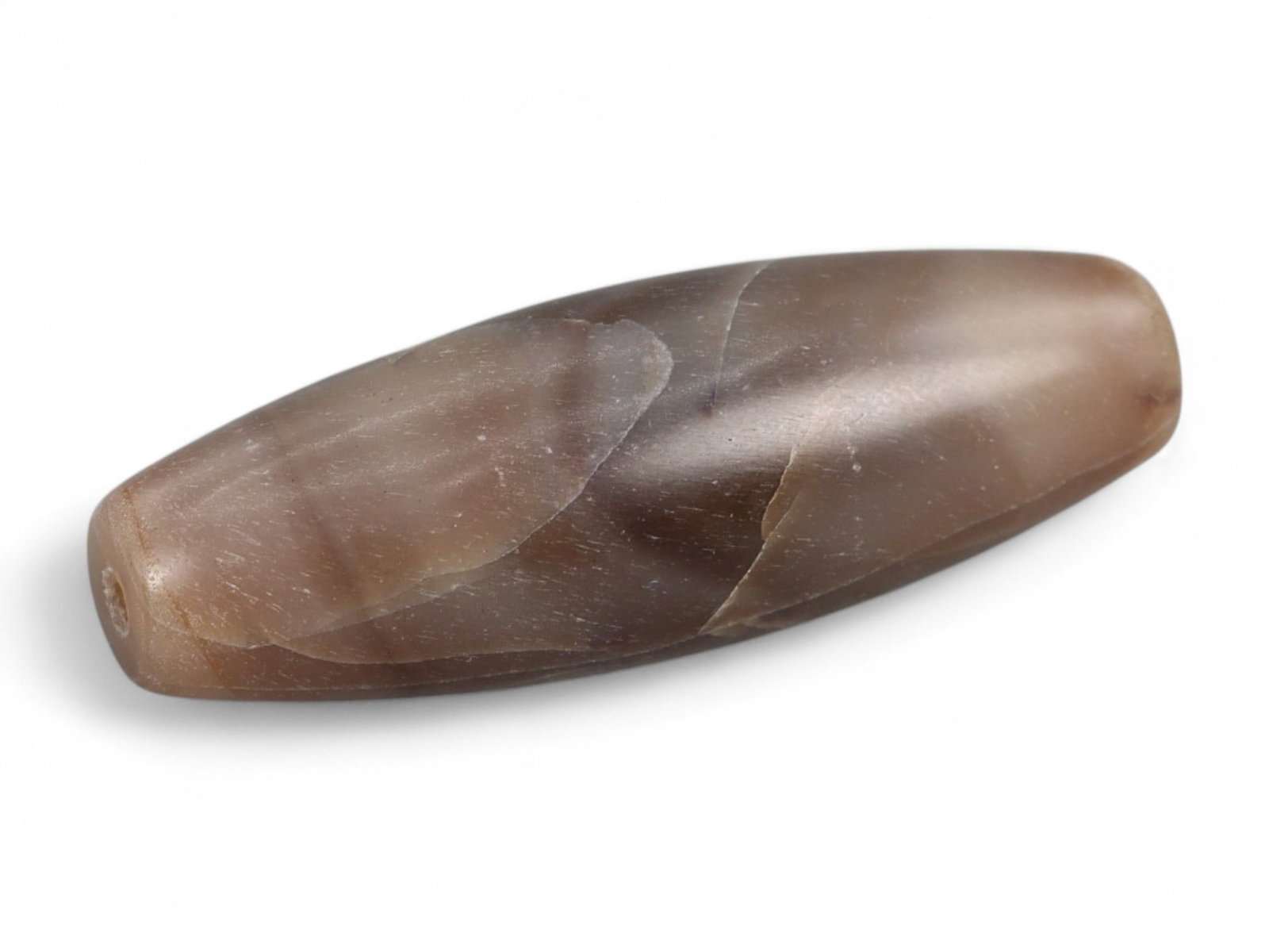 Antique Tibetan-Himalayan Banded Agate Trade Bead, 17th-19th Century, 3cm, 4.39g: This finely polished agate bead, is an elegant survivor of the vibrant Himalayan and Central Asian trade routes of the 17th-19th centuries. Its naturally occurring banded striations in soft honey, cre