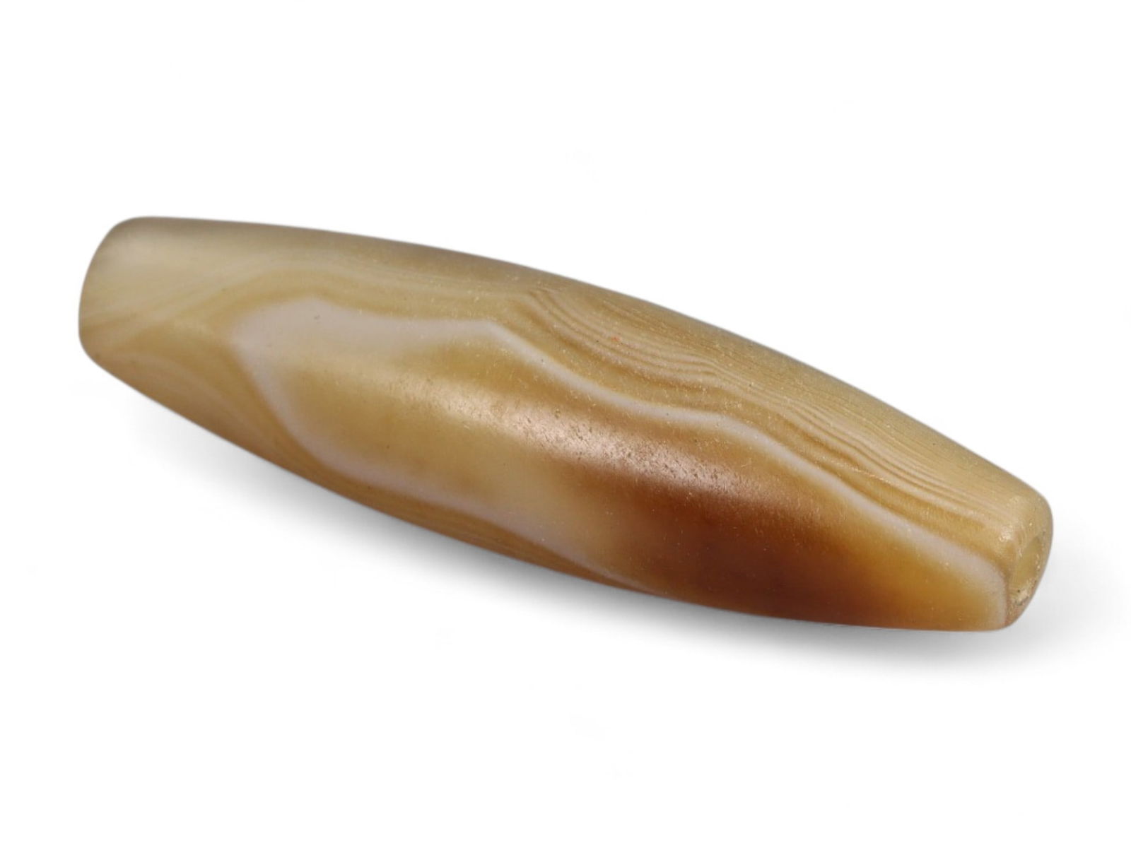 Antique Tibetan-Himalayan Banded Agate Trade Bead, 17th-19th Century, 3cm, 2.86g: This finely polished agate bead, is an elegant survivor of the vibrant Himalayan and Central Asian trade routes of the 17th-19th centuries. Its naturally occurring banded striations in soft honey, cre