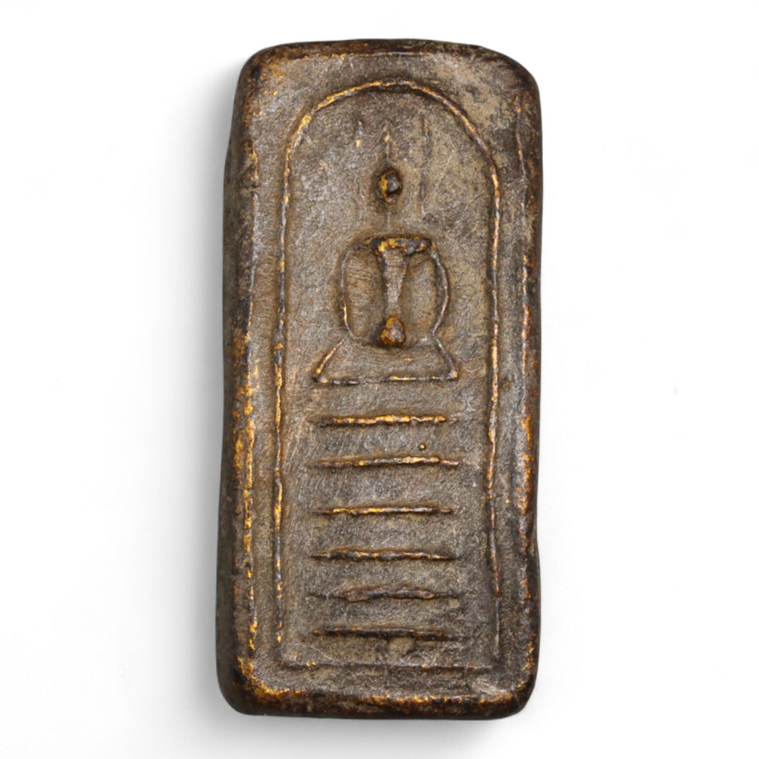 Antique Thai Elongated Somdej Clay Buddha Amulet, c. 19th-20th Century - 12g: This antique Thai amulet features a stylized depiction of the Buddha seated in deep meditation atop a nine-tiered base, all enclosed within a softly arched frame. Uniquely elongated in shape, the amul