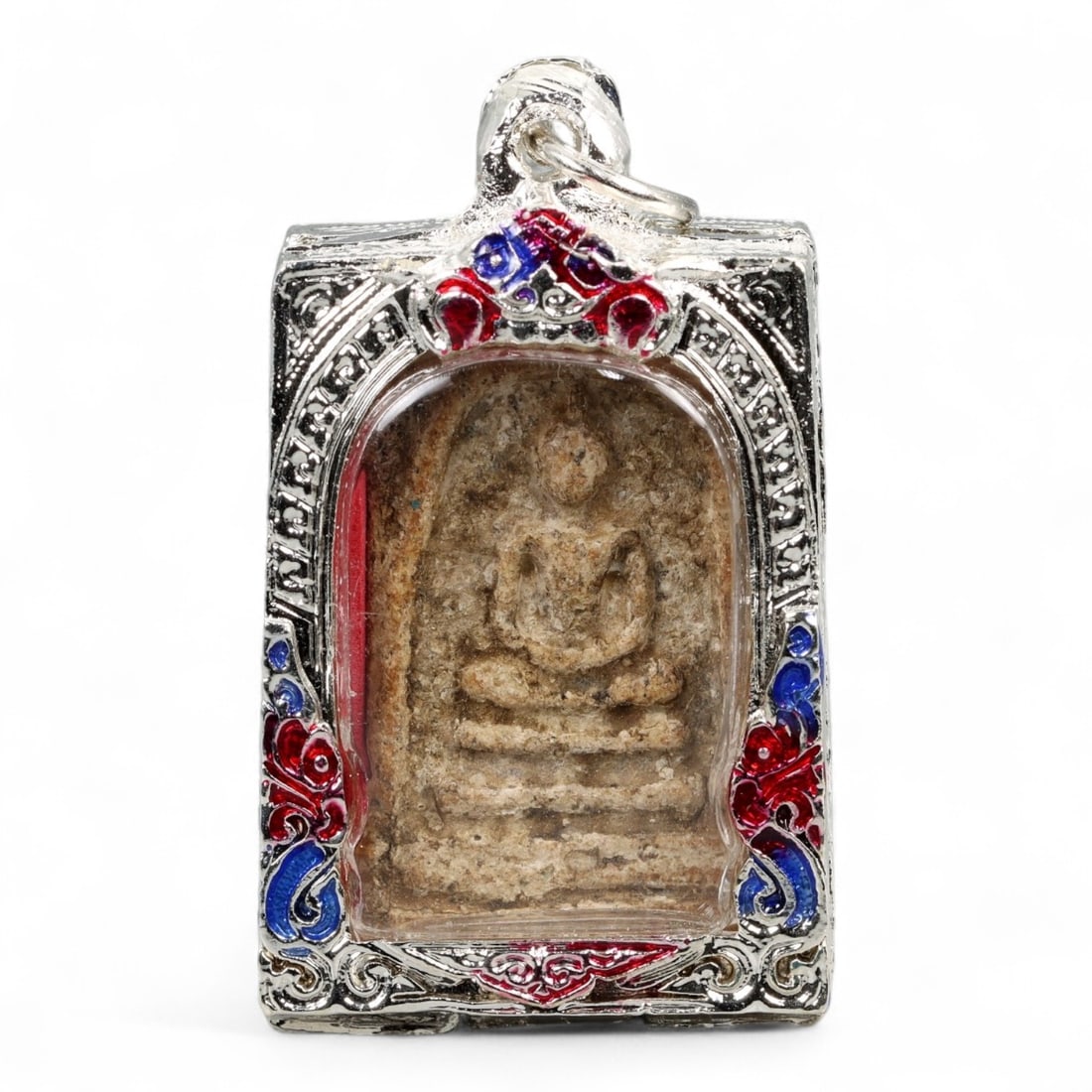 Antique Thai Somdej Style Buddha Amulet Stucco Pendant, 19th-20th Century, 63g: This Thai amulet, crafted in the iconic Somdej style, features a seated Buddha rendered in high-relief stucco or pressed clay, enclosed within an ornate silver-toned case with vibrant red and blue ena