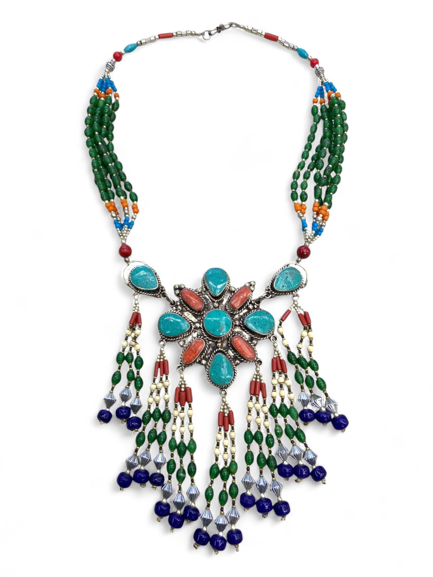 Vintage Himalayan Tribal Turquoise Coral Silver Floral Pendant Necklace, 20th Century, 210g: This vintage Himalayan necklace commands attention with its radiant floral pendant, a powerful expression of tribal artistry and symbolism. The central design features turquoise and coral cabochons se