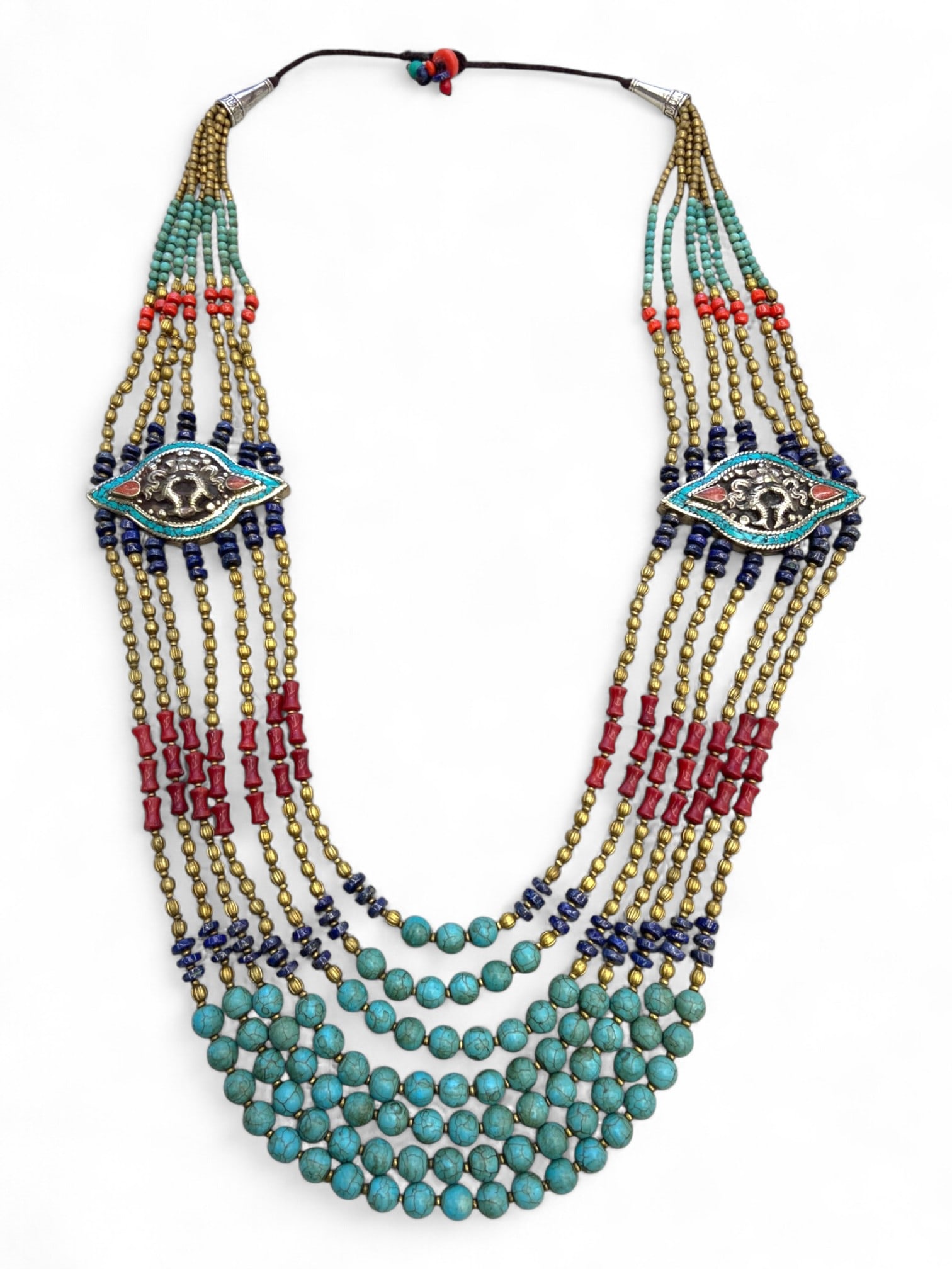 Vintage Himalayan Tribal Turquoise Coral Brass Silver Eye Amulet Necklace, 20th Century, 235g: This vintage Himalayan necklace is a commanding ceremonial piece, distinguished by its twin "eye" amulet plaques set into the strand arrangement. These eye-shaped silver plaques, inlaid with turquoise