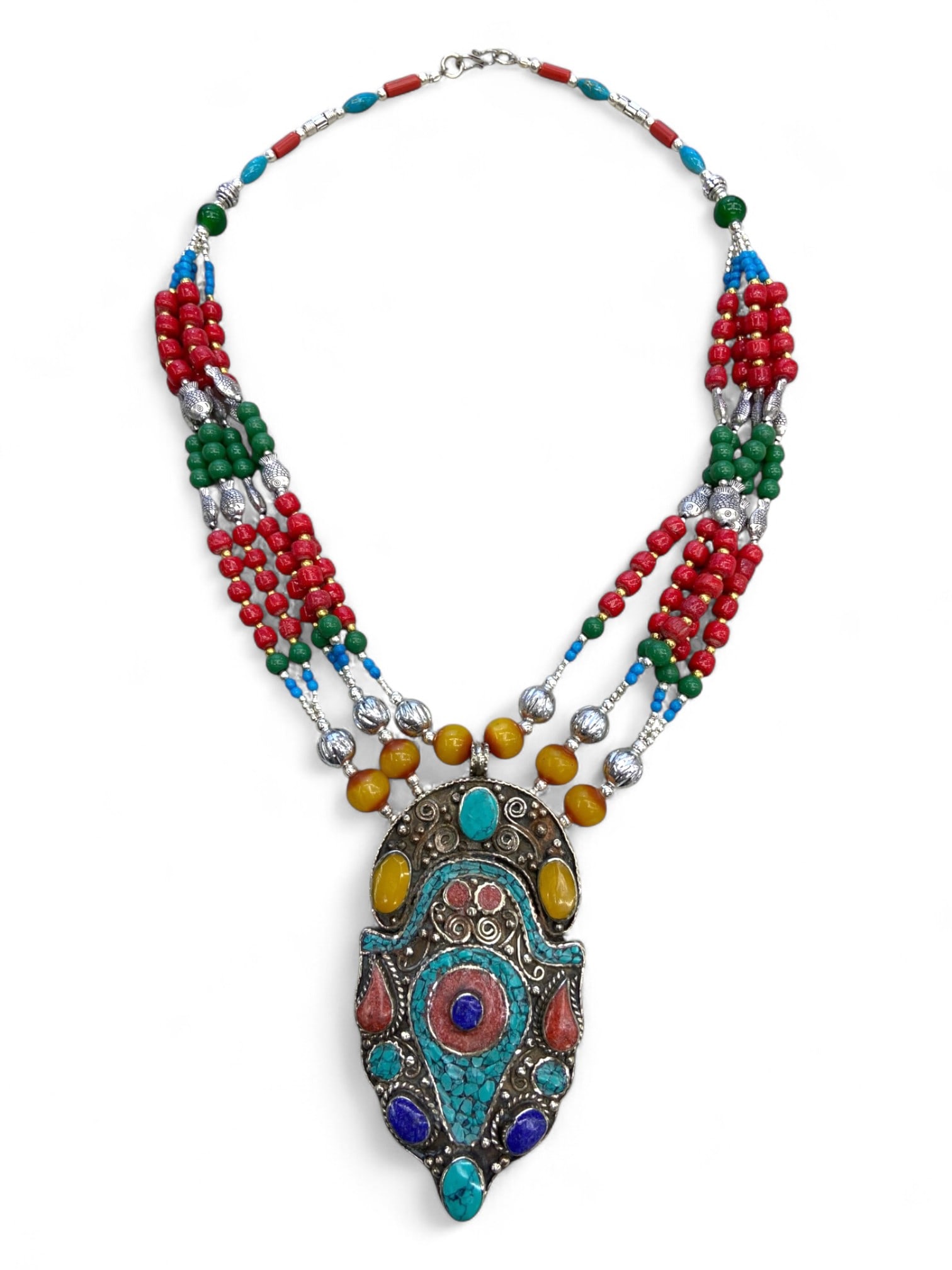 Vintage Himalayan Tribal Turquoise Coral Amber Silver Amulet Necklace, 20th Century, 175g: This vintage Himalayan necklace is centered by a large silver amulet pendant richly inlaid with turquoise, coral, amber, and lapis, forming a vibrant mosaic of protective symbolism. The amulet, with i