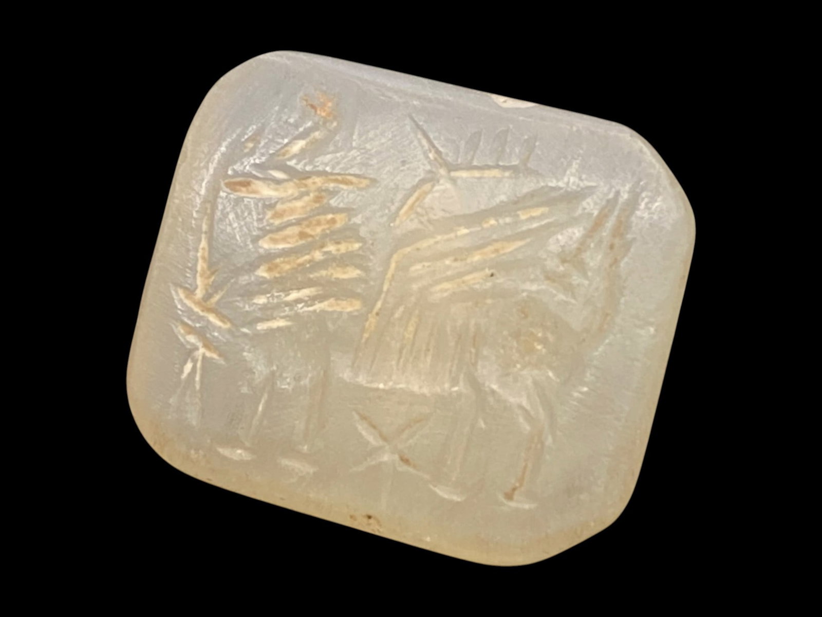 Ancient Neo-Assyrian Rock Crystal Stamp Seal with Winged Griffin, c. 9th-7th Century BCE, 8g: This finely carved rock crystal stamp seal, dating to the Neo-Assyrian period (c. 9th-7th century BCE), reflects the sophisticated artistry and symbolic power of Mesopotamian glyptic tradition. Measur