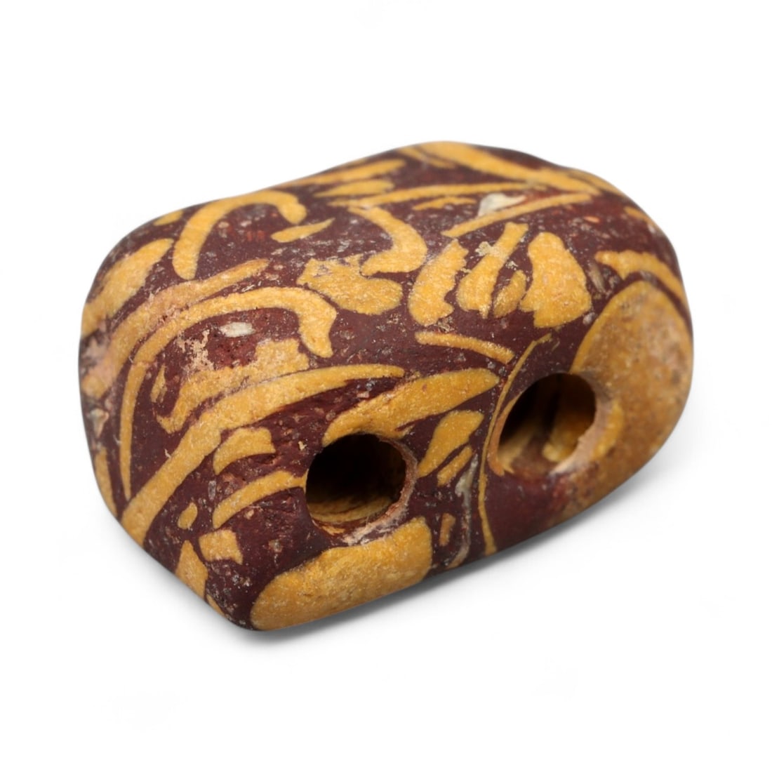 Ancient Indus Valley Fossilized Stromatolite Bead, c. 3rd-2nd Millennium BCE, 1cm: This remarkable bead is carved from fossilized stromatolite, a stone composed of layered mineral deposits created by some of Earth's earliest microbial life. Stromatolite beads were especially prized 