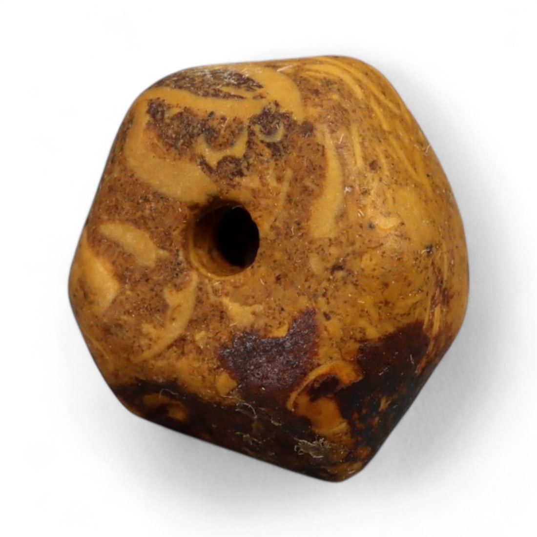 Ancient Indus Valley Fossilized Stromatolite Bead, c. 3rd-2nd Millennium BCE, 1cm: This remarkable bead is carved from fossilized stromatolite, a stone composed of layered mineral deposits created by some of Earth's earliest microbial life. Stromatolite beads were especially prized 
