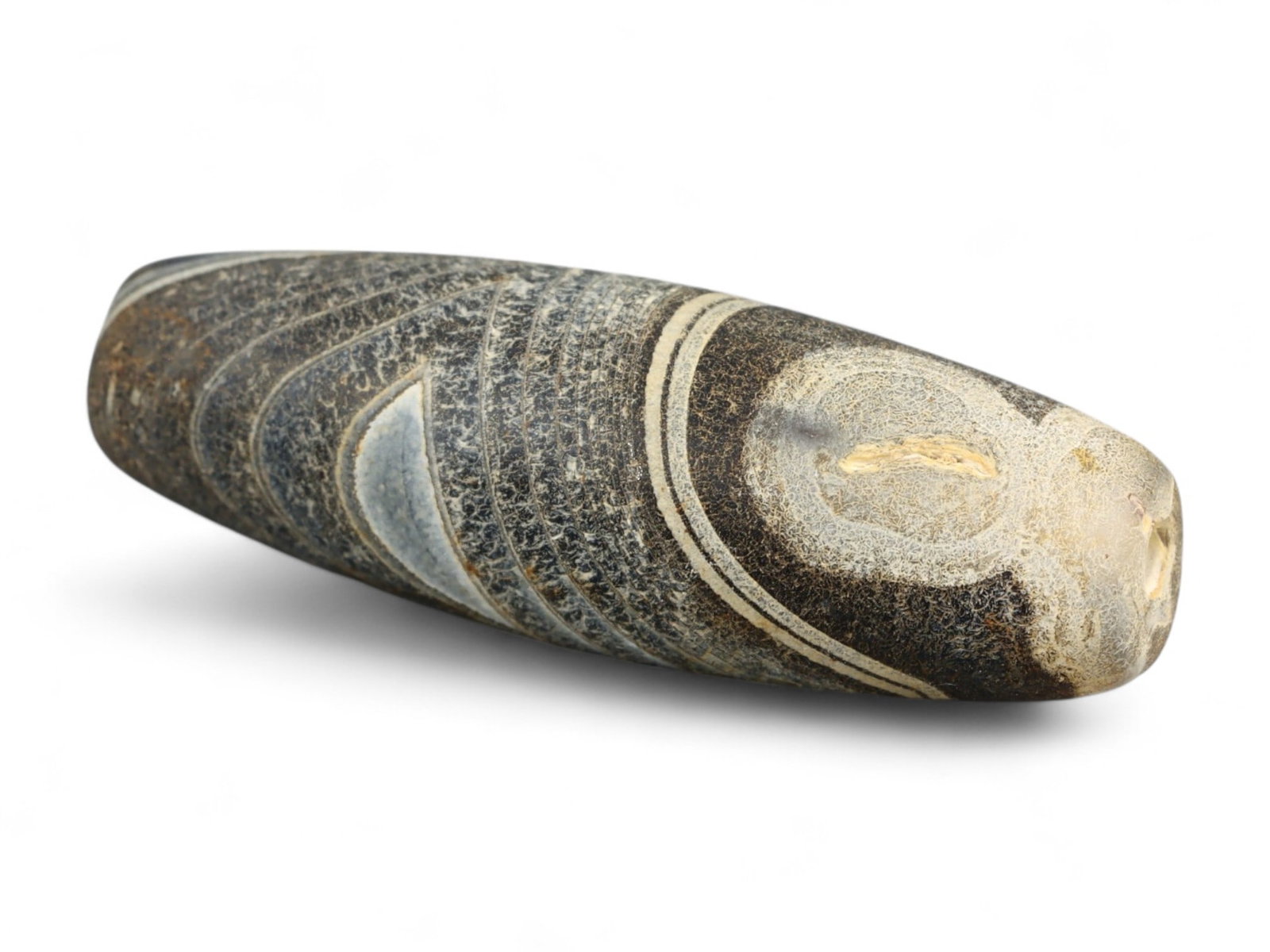 Ancient Gandhara Banded Sulaimani Agate Bead, c. 1st-3rd Century CE, 3cm: This striking banded agate bead, often referred to as a Sulaimani bead, originates from the Gandhara region, c. 1st-3rd century CE, during the height of the Kushan Empire. Gandhara, straddling present