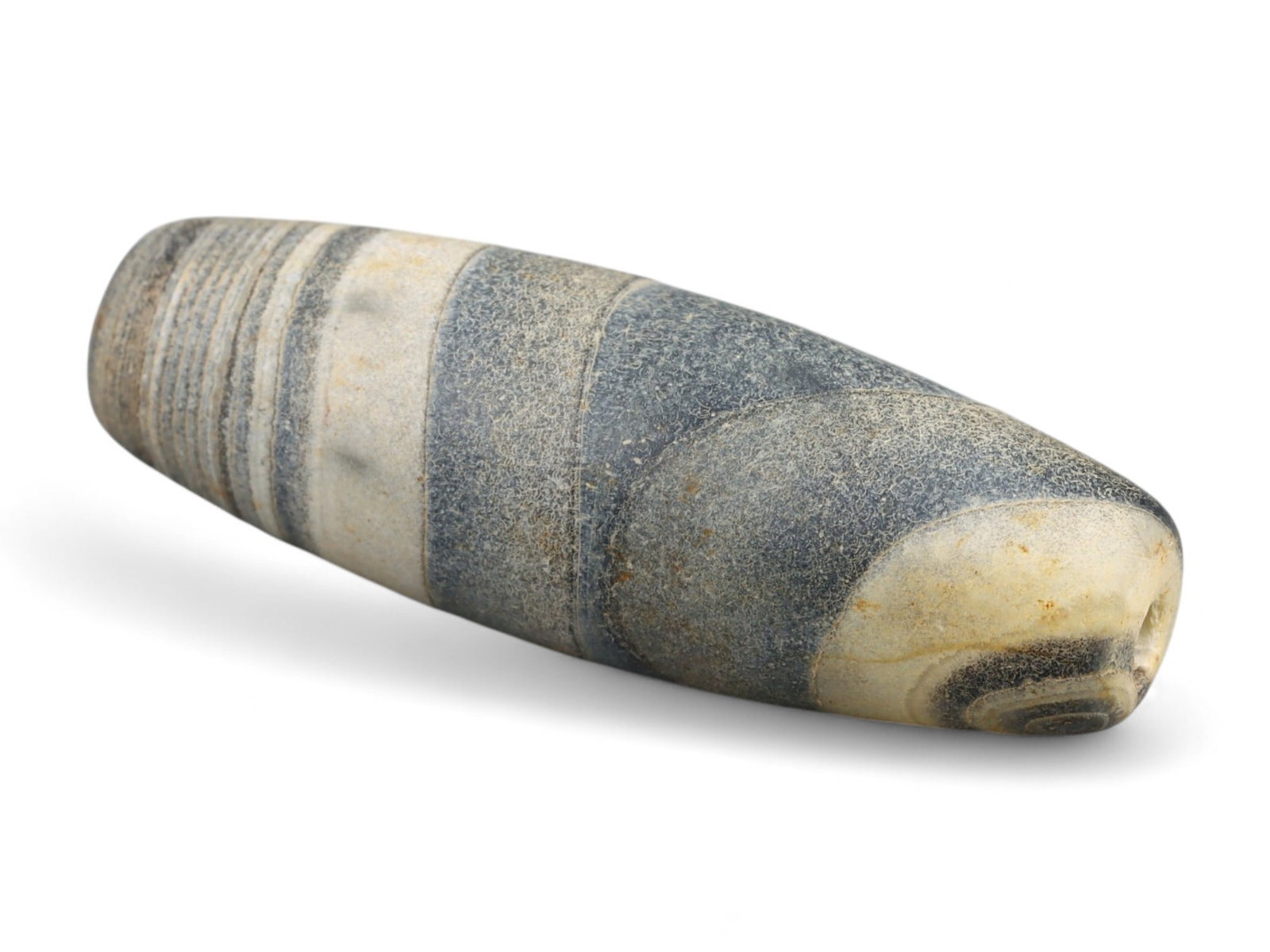 Ancient Gandhara Banded Sulaimani Agate Bead, c. 1st-3rd Century CE, 3cm: This striking banded agate bead, often referred to as a Sulaimani bead, originates from the Gandhara region, c. 1st-3rd century CE, during the height of the Kushan Empire. Gandhara, straddling present
