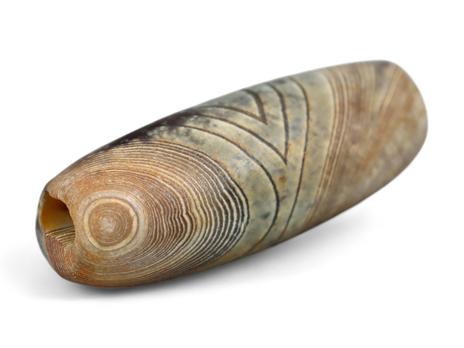 Ancient Indus Valley Banded Agate Lentoid Bead, c. 3rd Millennium BCE, 1.5cm: This elegant bead, carved from banded agate, dates to the Indus Valley Civilization (c. 3300-1300 BCE), one of the world's earliest urban cultures. The Indus people were renowned for their sophisticat