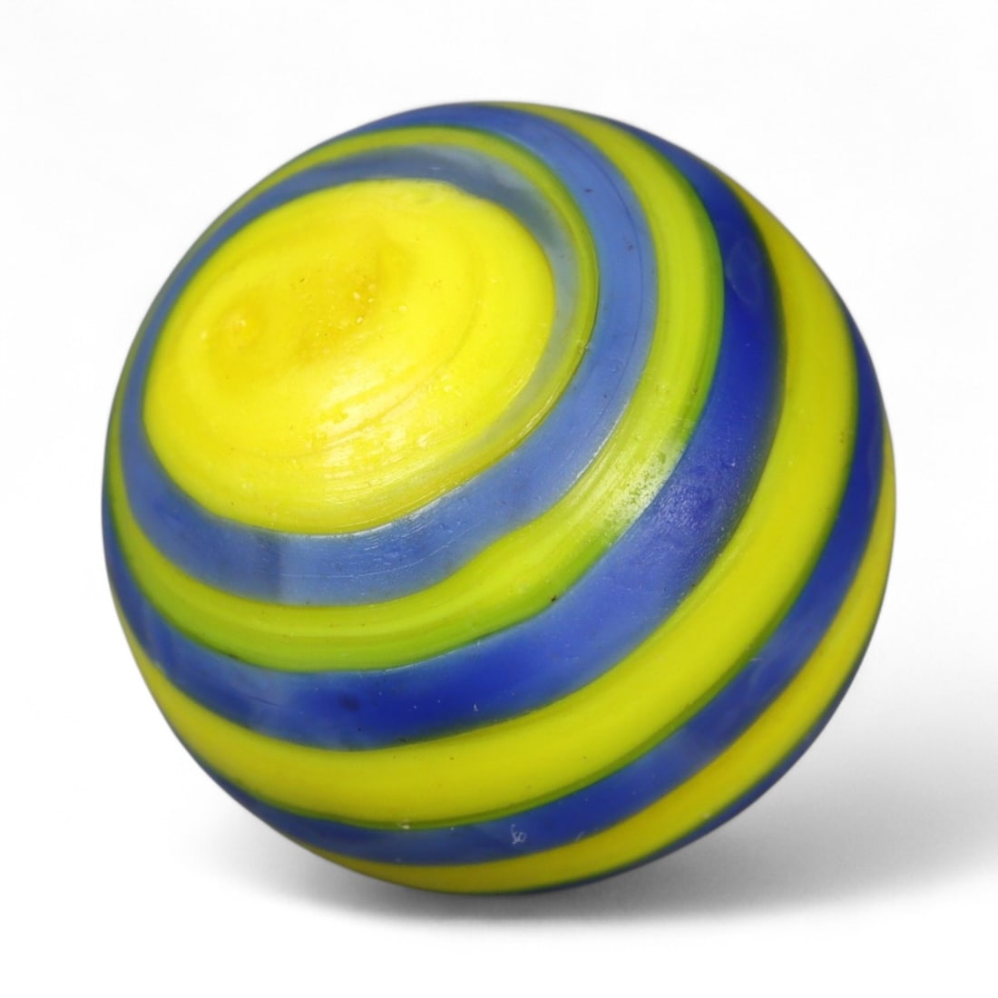 Vintage Swirled Pattern Glass Marble, c. Early-Mid 20th Century, 1.5cm: This charming vintage marble, is crafted from glass with a striking swirl design. Its spiraled pattern, creates a mesmerizing effect that reflects the playful artistry of traditional marble-making. Ea