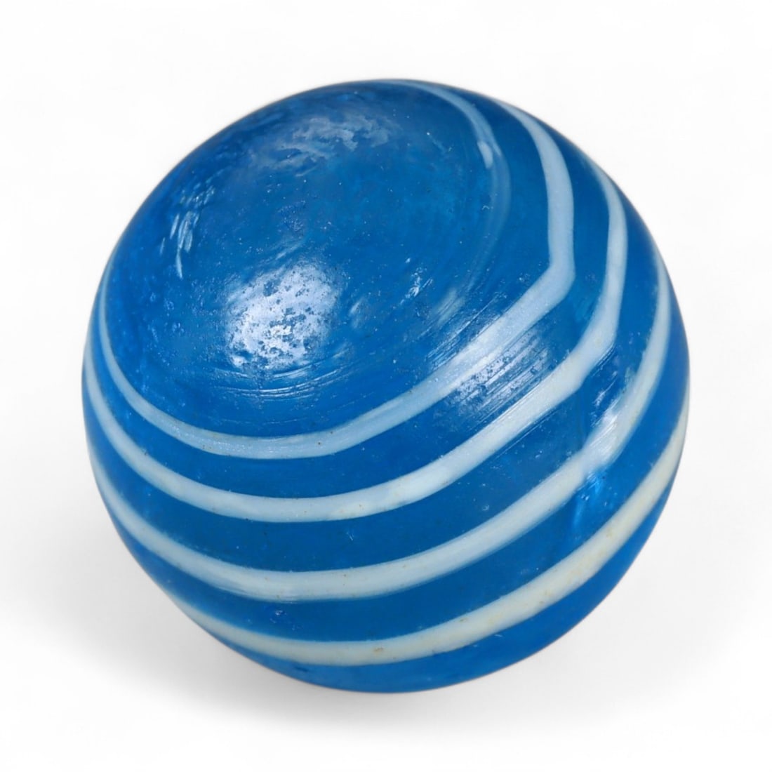 Vintage Swirled Pattern Glass Marble, c. Early-Mid 20th Century, 1.5cm: This charming vintage marble, is crafted from glass with a striking swirl design. Its spiraled pattern, creates a mesmerizing effect that reflects the playful artistry of traditional marble-making. Ea