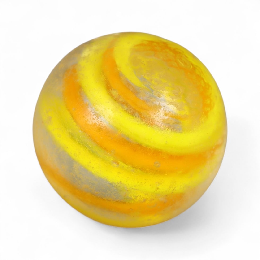 Vintage Swirled Pattern Glass Marble, c. Early-Mid 20th Century, 1.6cm: This charming vintage marble, is crafted from glass with a striking swirl design. Its spiraled pattern, creates a mesmerizing effect that reflects the playful artistry of traditional marble-making. Ea