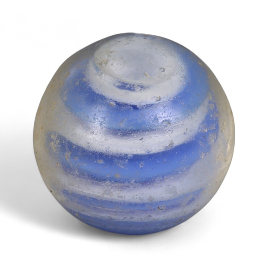 Vintage Swirled Pattern Glass Marble, c. Early-Mid 20th Century, 1.5cm: This charming vintage marble, is crafted from glass with a striking swirl design. Its spiraled pattern, creates a mesmerizing effect that reflects the playful artistry of traditional marble-making. Ea