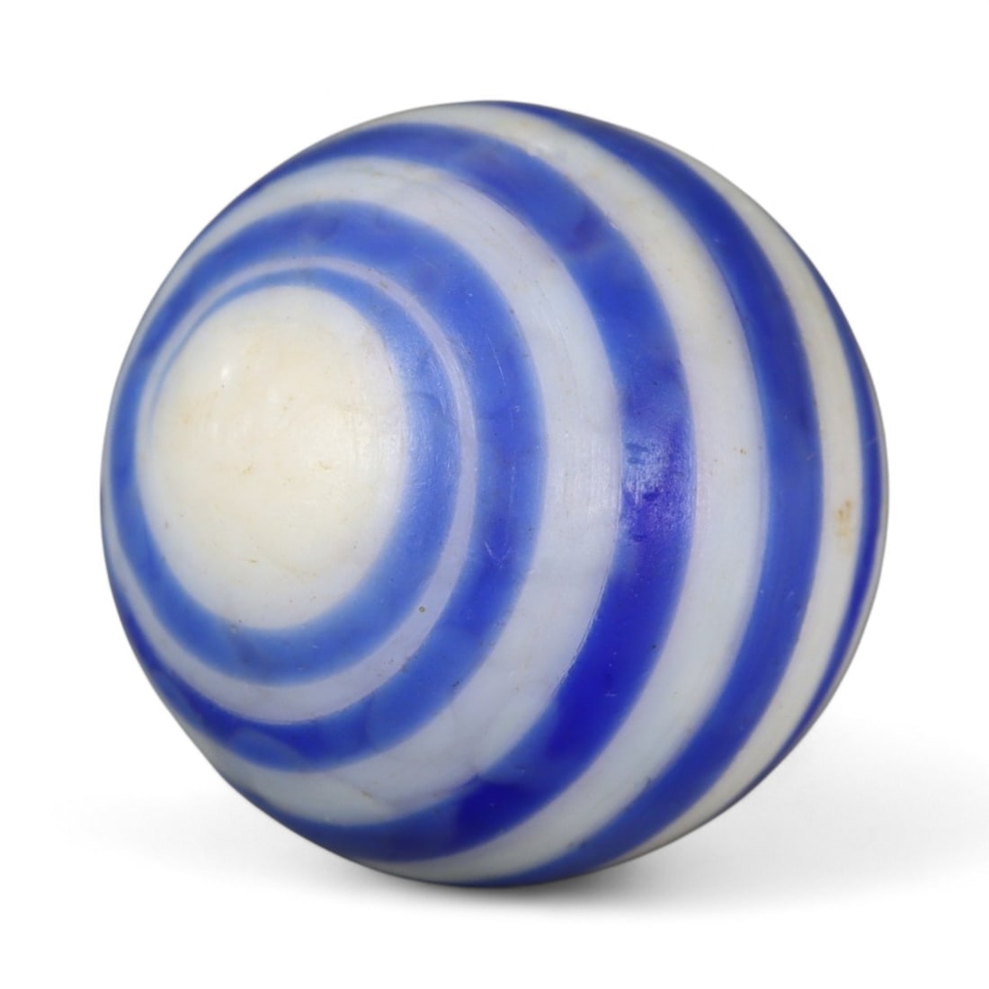 Vintage Swirled Pattern Glass Marble, c. Early-Mid 20th Century, 1.5cm: This charming vintage marble, is crafted from glass with a striking swirl design. Its spiraled pattern, creates a mesmerizing effect that reflects the playful artistry of traditional marble-making. Ea