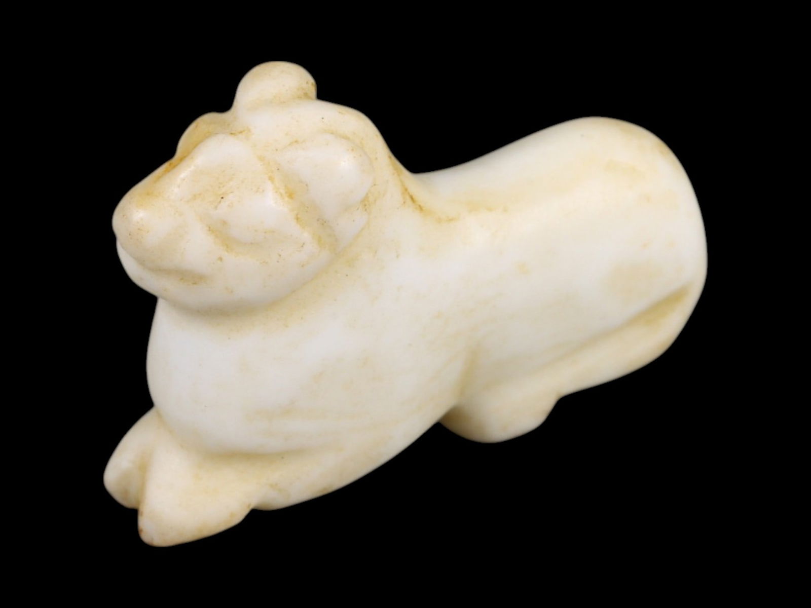 Ancient Neo-Sumerian Bone Feline Amulet, c. 2112-2004 BCE 2g: This small but captivating amulet, carved from bone in the form of a reclining feline, originates from the Neo-Sumerian period (Ur III), c. 2112-2004 BCE. Amulets of this kind were cherished across Me