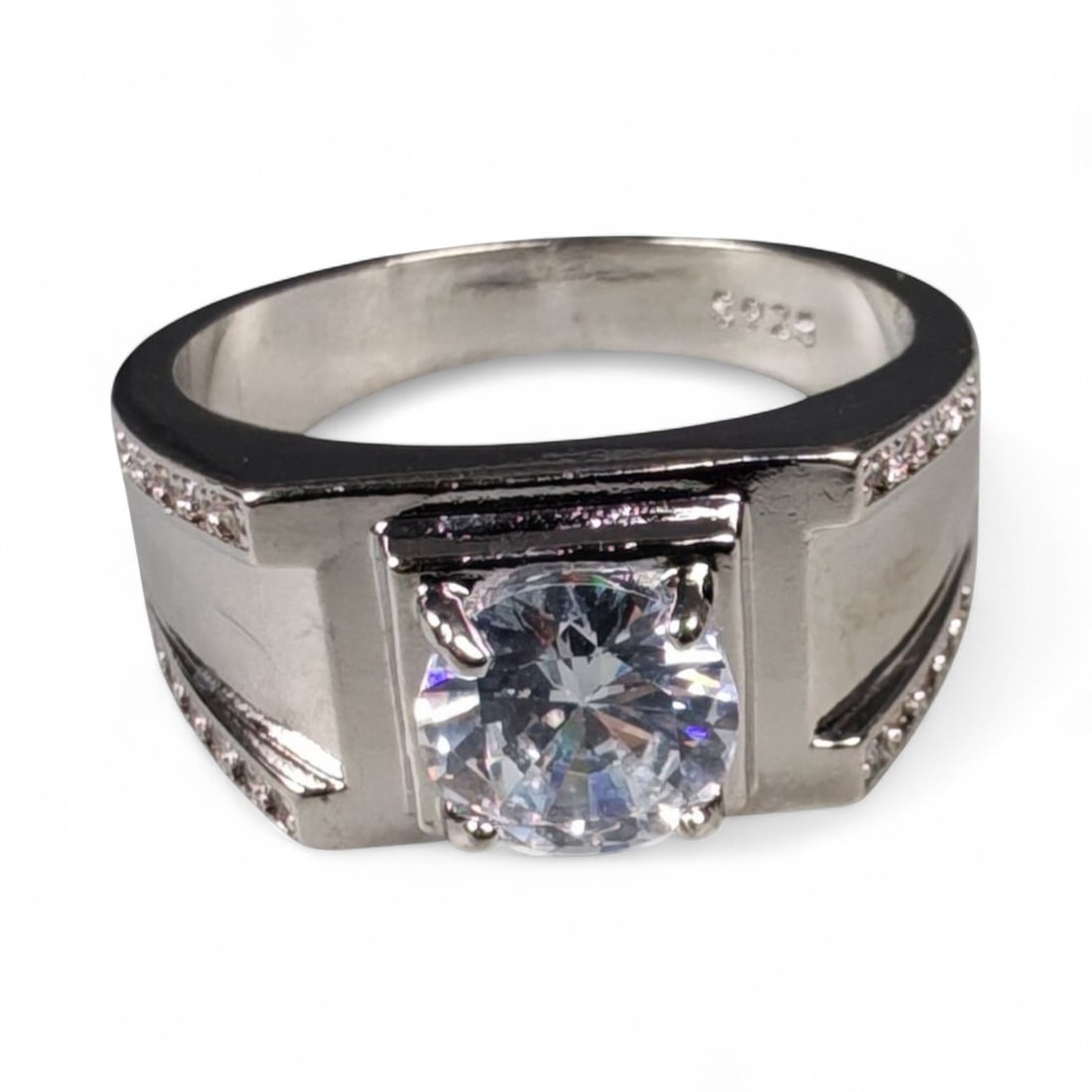 Antique Modernist 925 Sterling Silver Geometric Solitaire Ring, (US Size 11): This bold sterling silver ring embodies the refined geometry of modernist design. Crafted in solid 925 silver, its squared shoulders and structured lines frame a brilliant-cut clear gemstone that radi