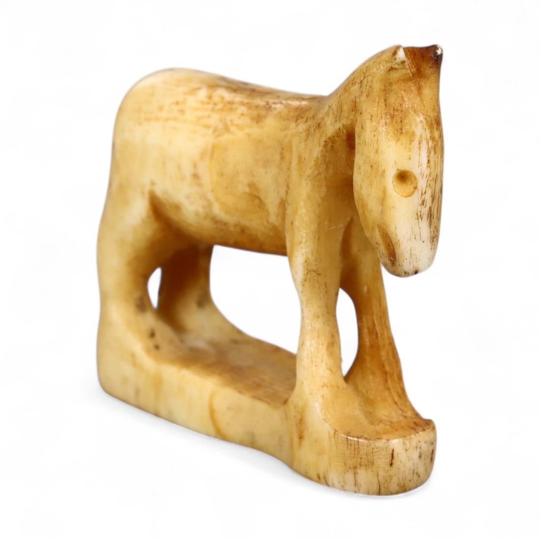 Antique Thai Horse Totem Carved Wood Amulet, 19th-20th Century, 7g: This antique Thai amulet, carved from wood in the form of a horse, dates to the 19th-20th century. Horses in Thai culture symbolize strength, loyalty, and endurance, qualities deeply valued in both da